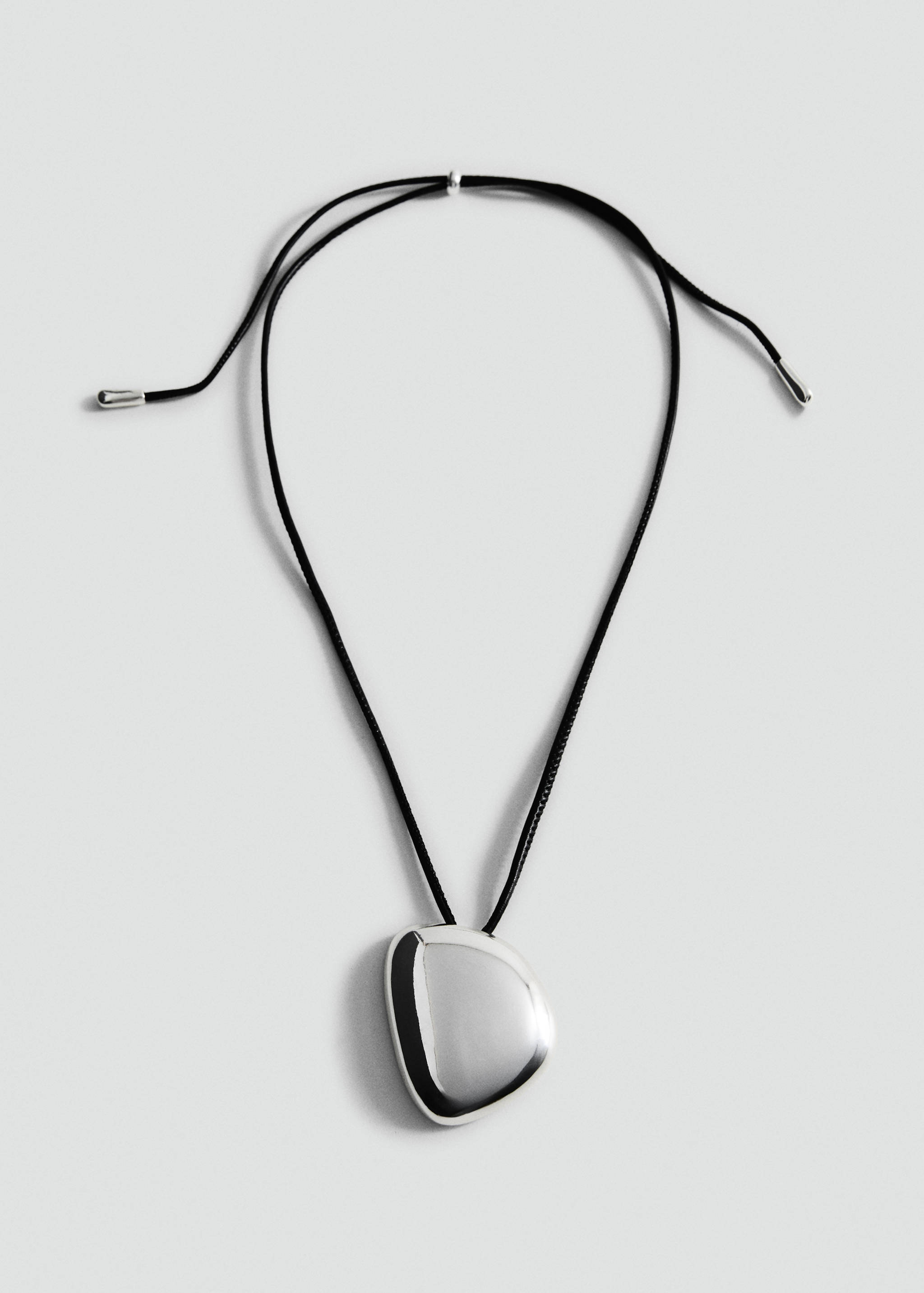 Collier pendentif pièce métallique - Article sans modèle