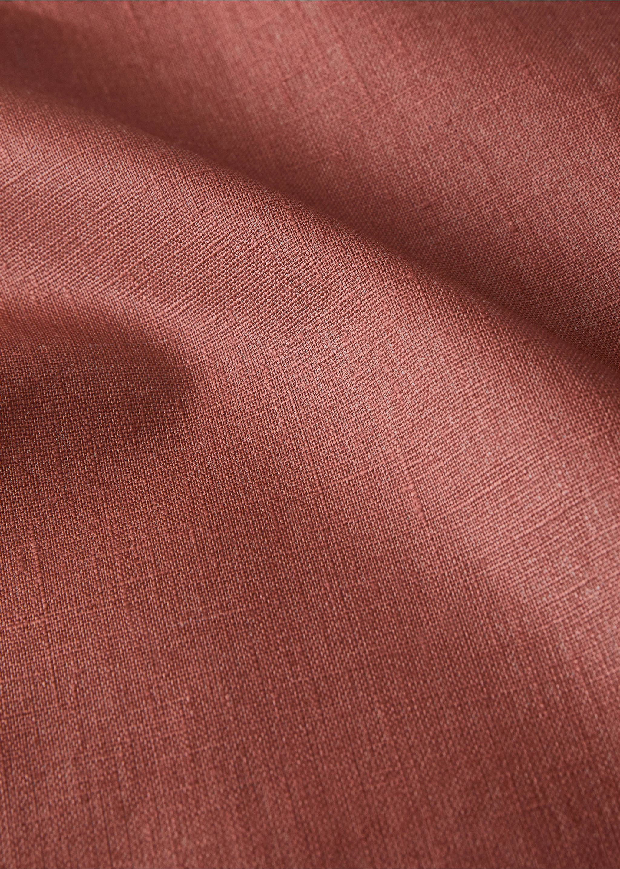 Resin-coated 100% linen tablecloth with contrasting overlock for 6 to 8 diners - Details of the article 2, Burnt Orange. Ref: 17004155-00.