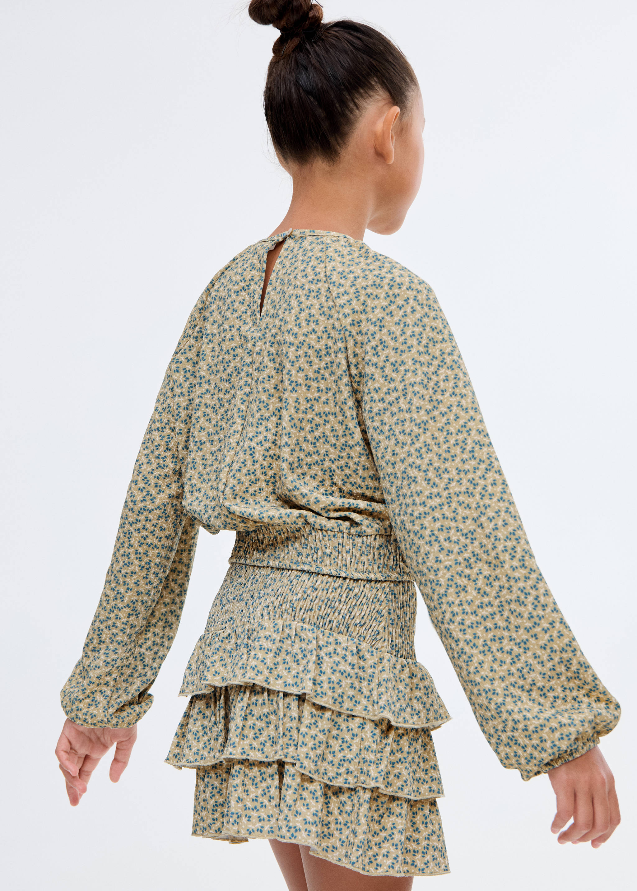 Blommigt tryck blus - Artikelns baksida