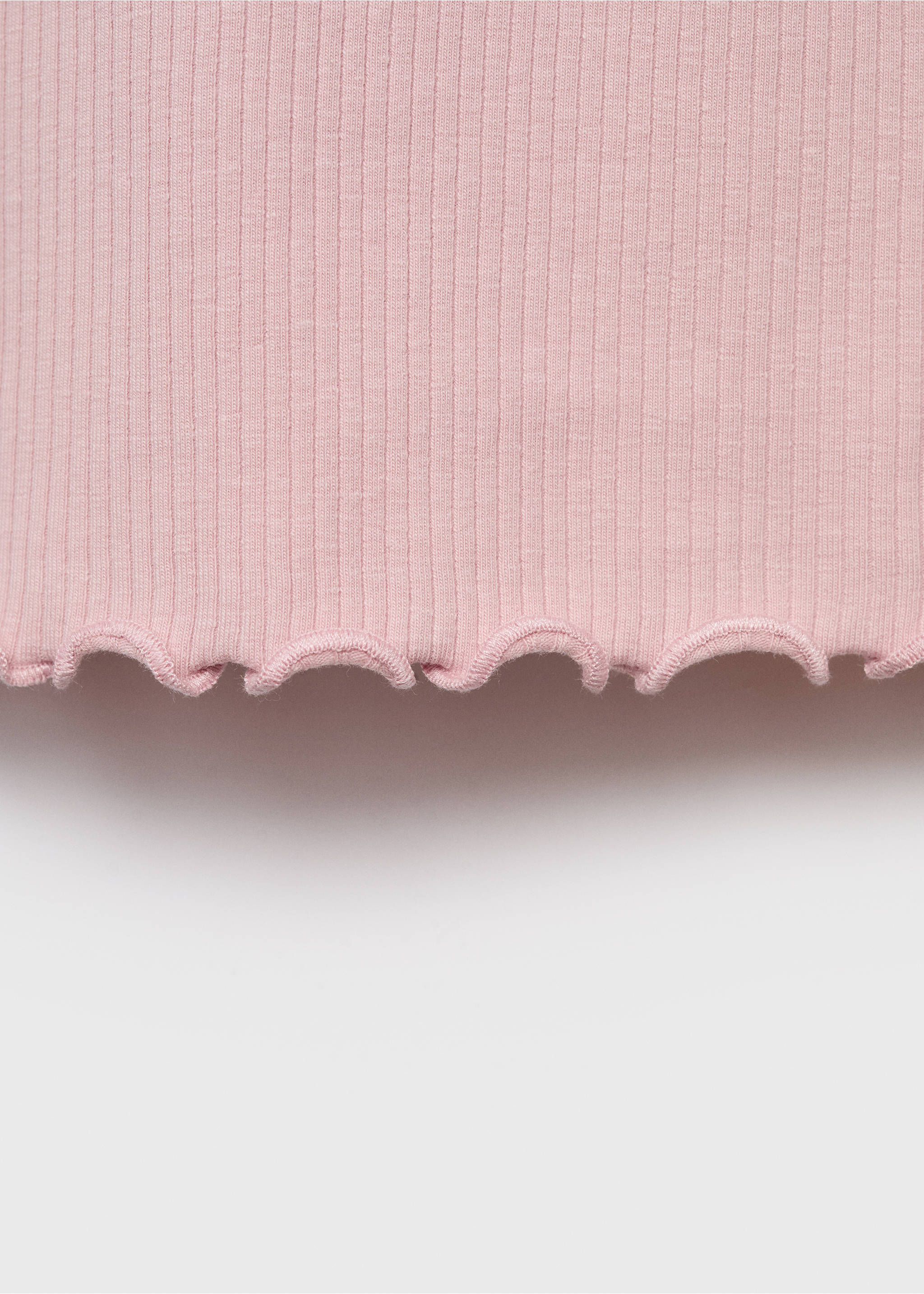 Close-up of a pink ribbed t-shirt with a lettuce edge hem., Pink. Ref: 17006340-00.