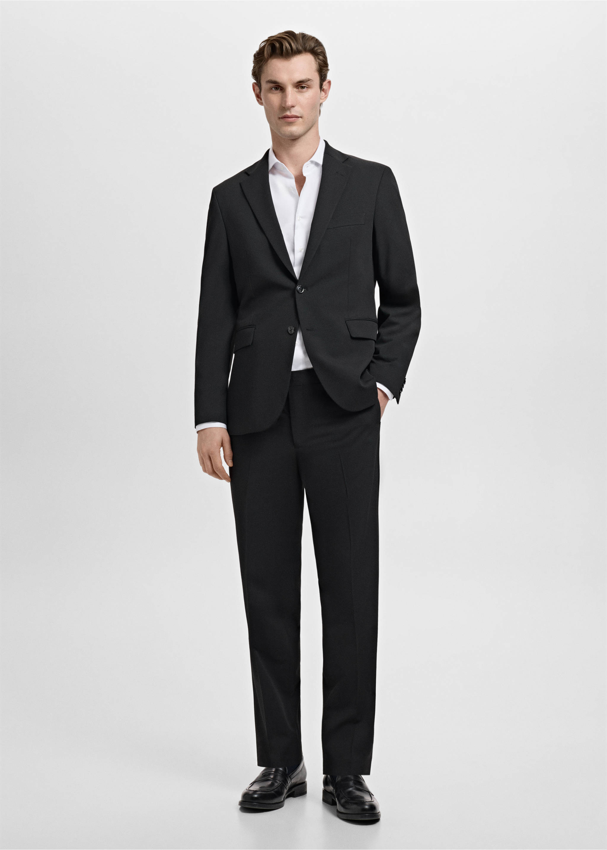 Black blazer with notched lapels and two buttons, worn with a white shirt and black trousers., Black. Ref: 17009607-00.