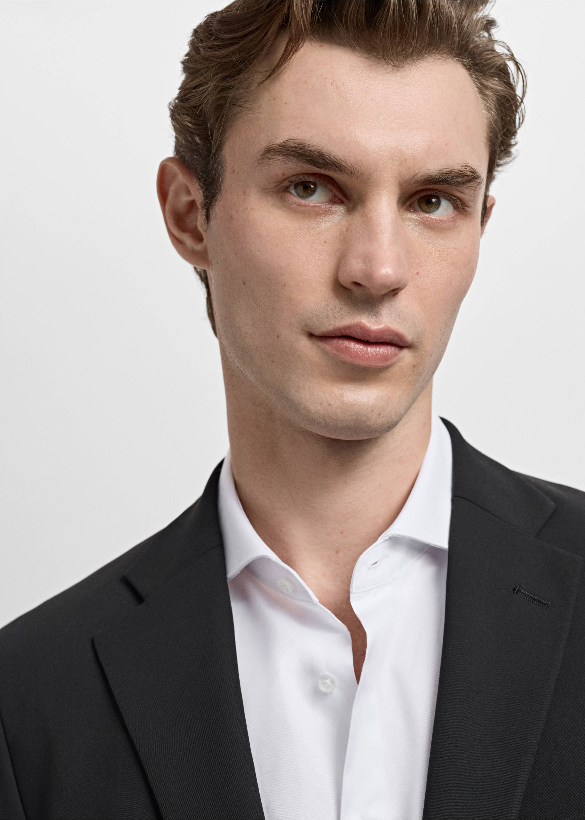Close-up of a black blazer worn with a white shirt., Black. Ref: 17009607-00.