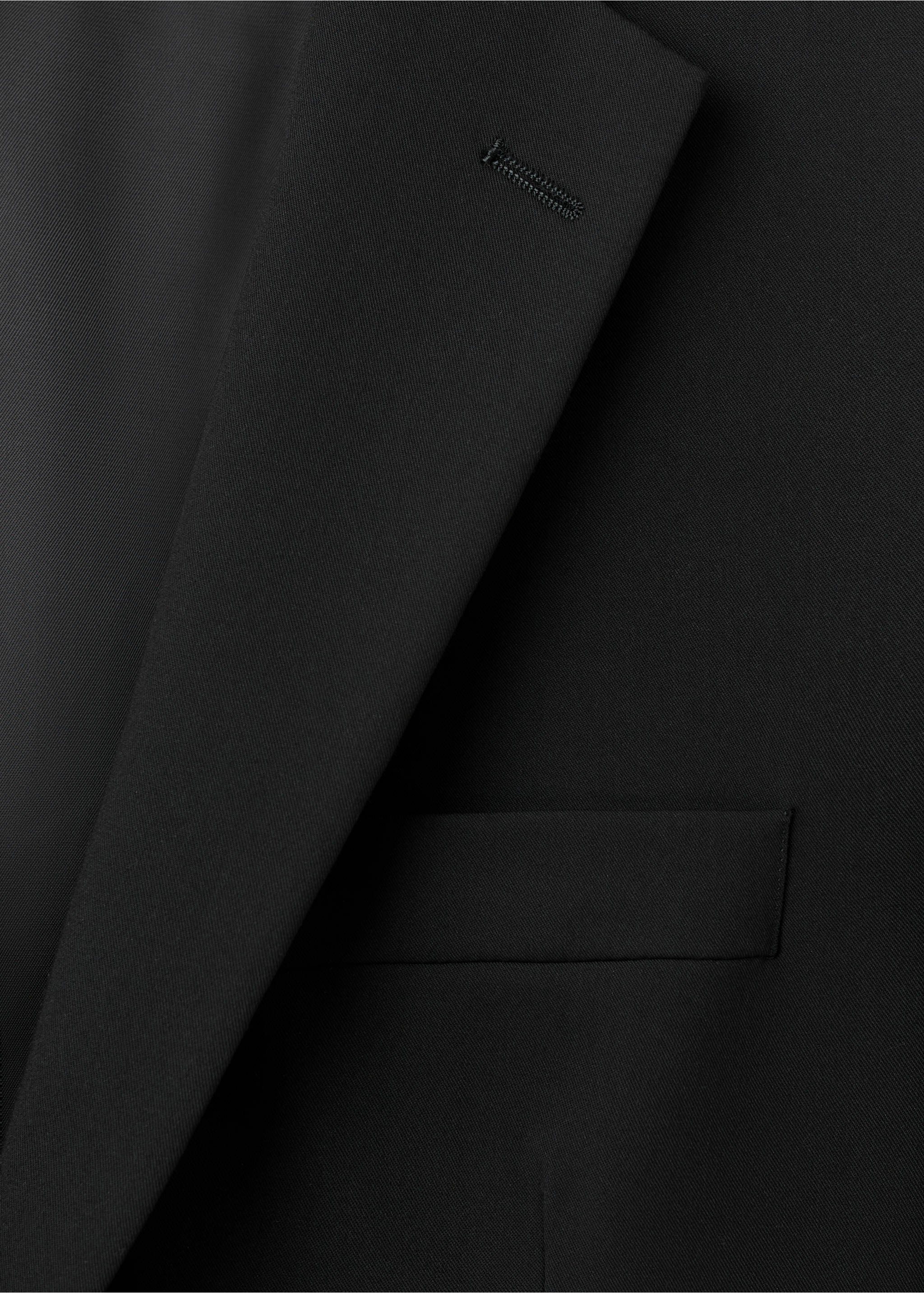 Close-up of a black blazer showing lapel and chest pocket., Black. Ref: 17009607-00.