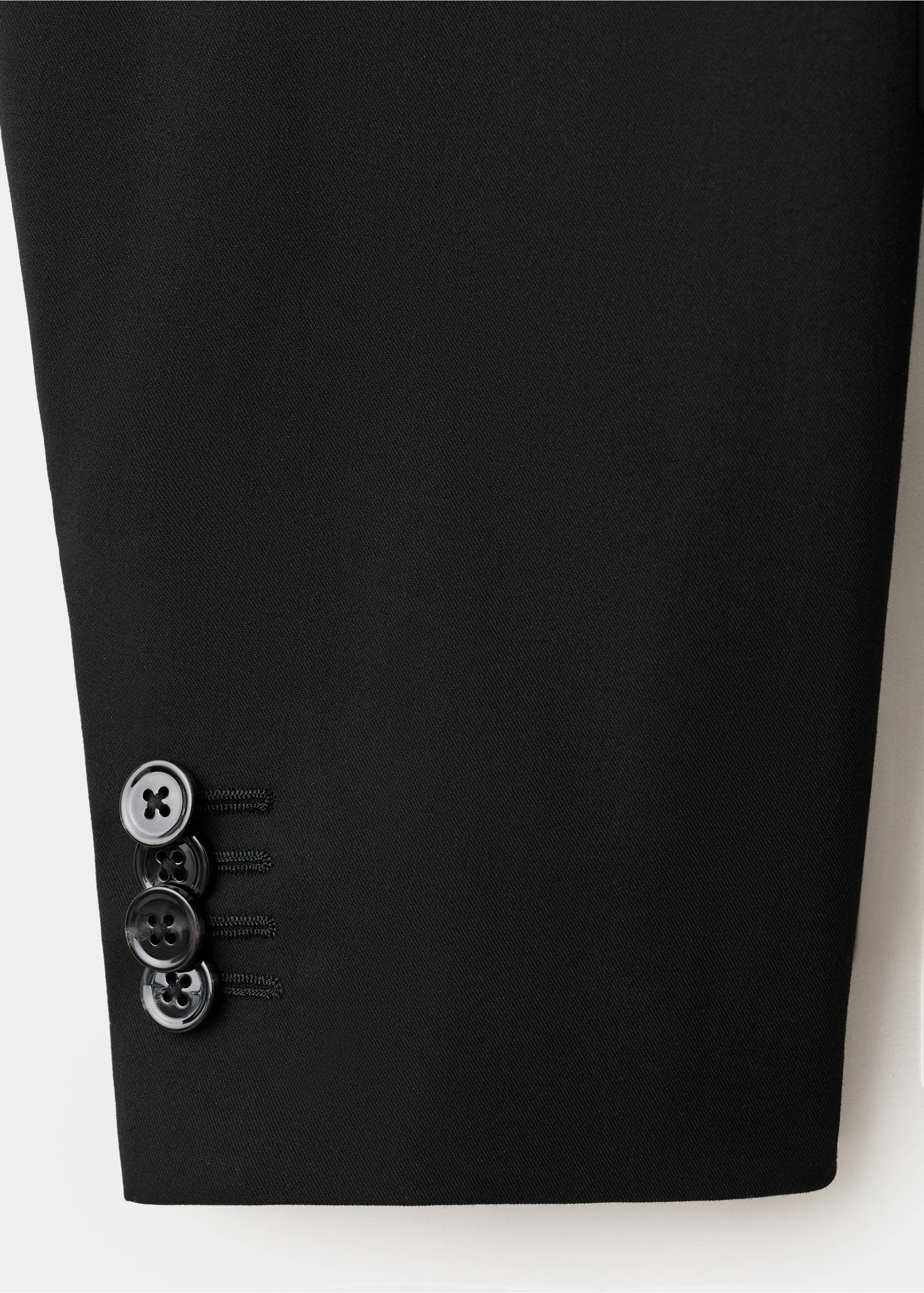 Close-up of black blazer sleeve cuff with four stacked buttons., Black. Ref: 17009607-00.