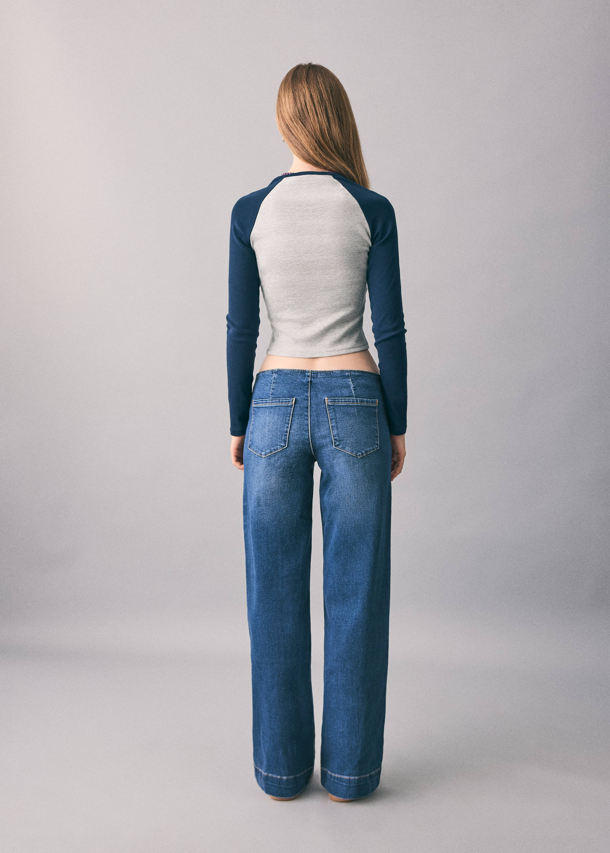 Low-waist studded jeans - Reverse of the article