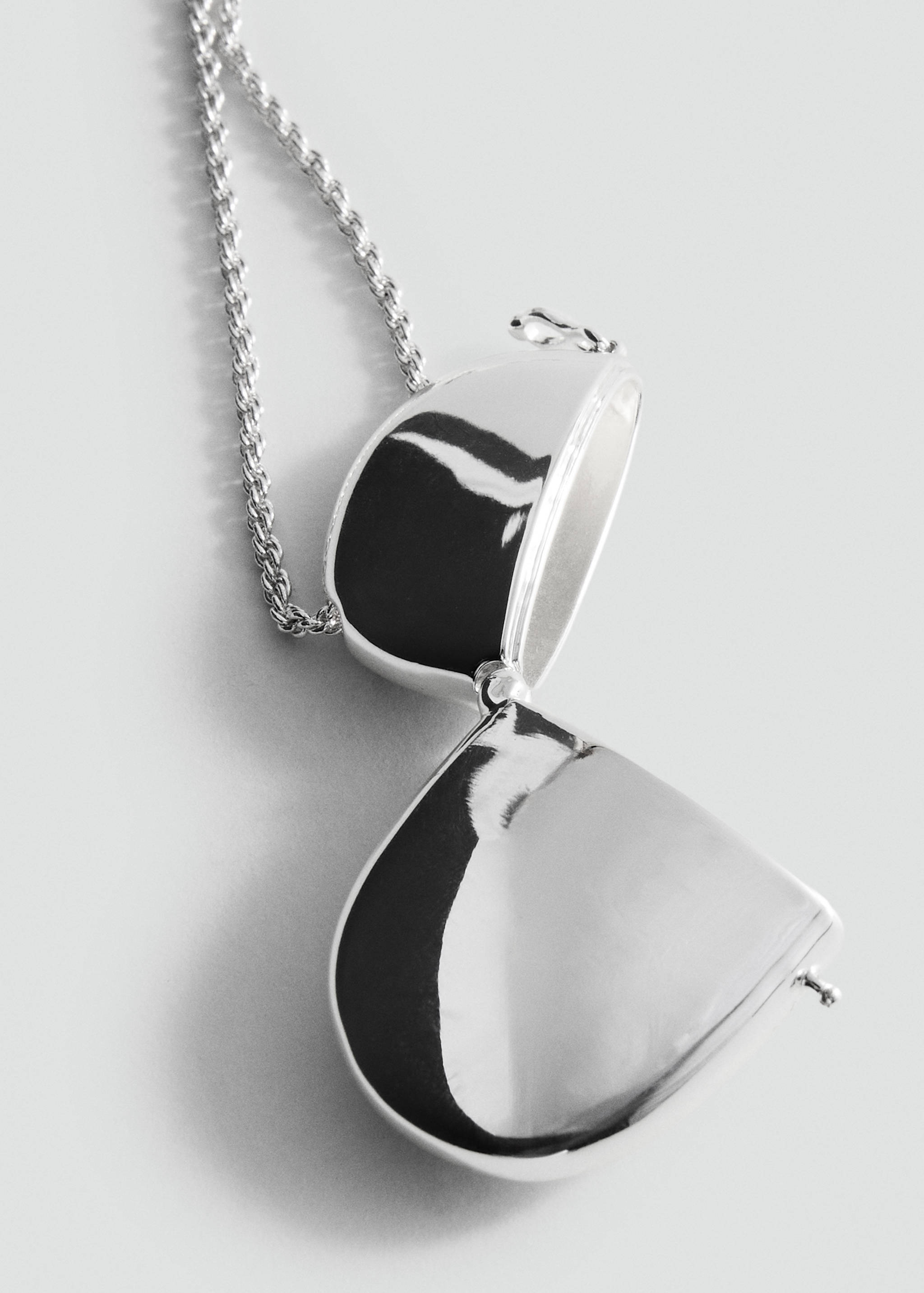 Metalliskt hänge halsband - Bild av mittparti