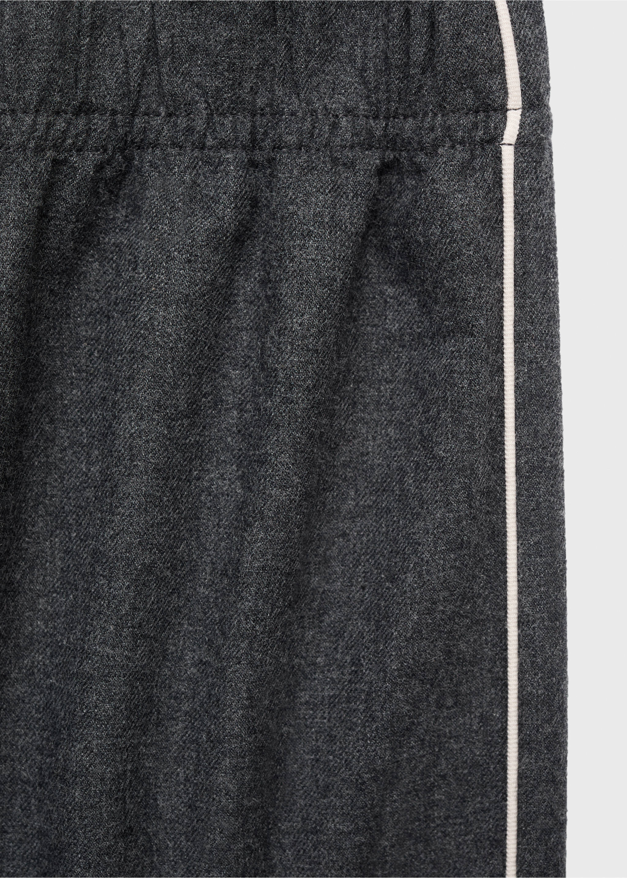 Close-up of dark grey pyjama trousers fabric with white piping, Charcoal. Ref: 17017130-00.