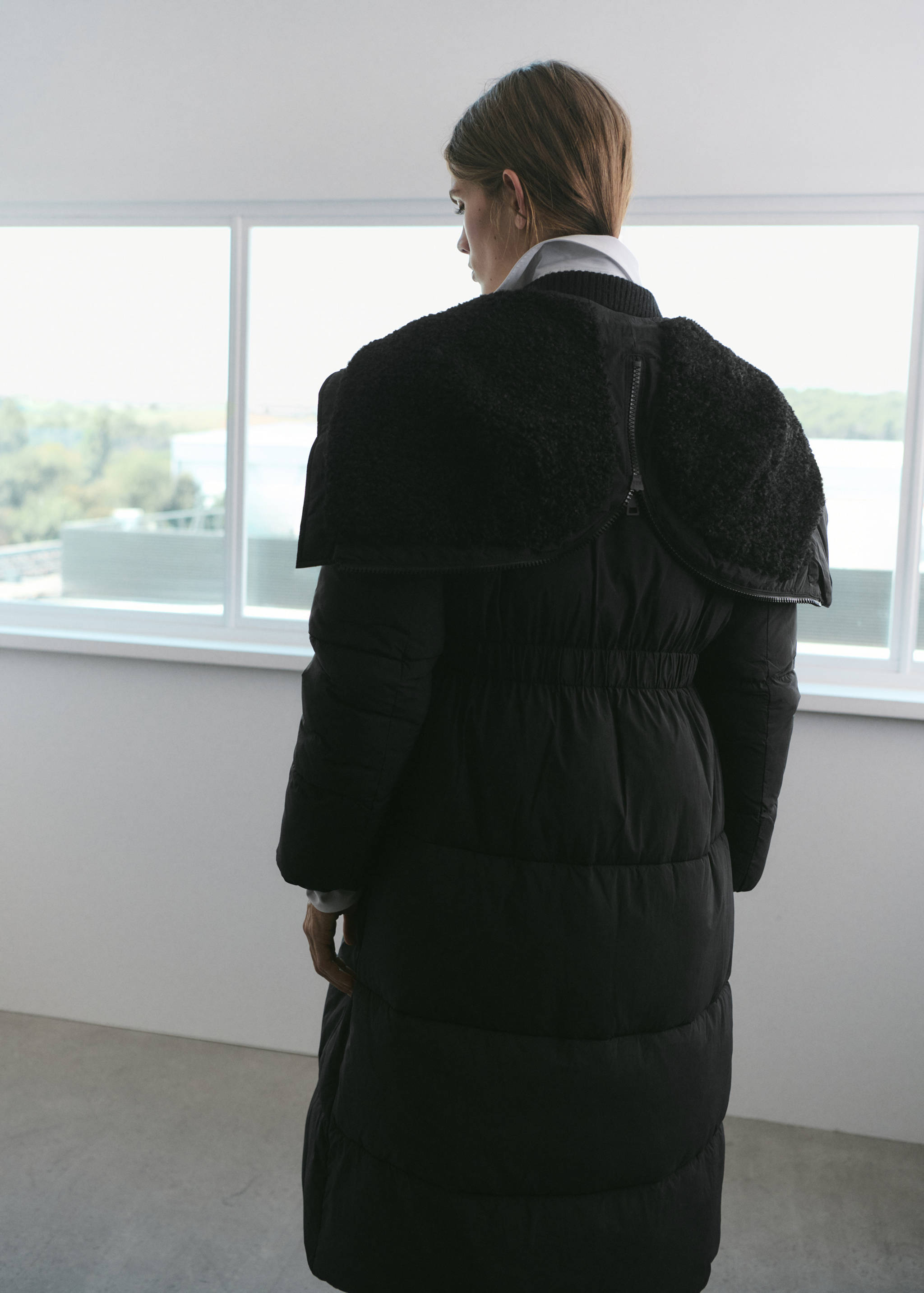 Fitted quilted anorak with hood - Reverse of the article