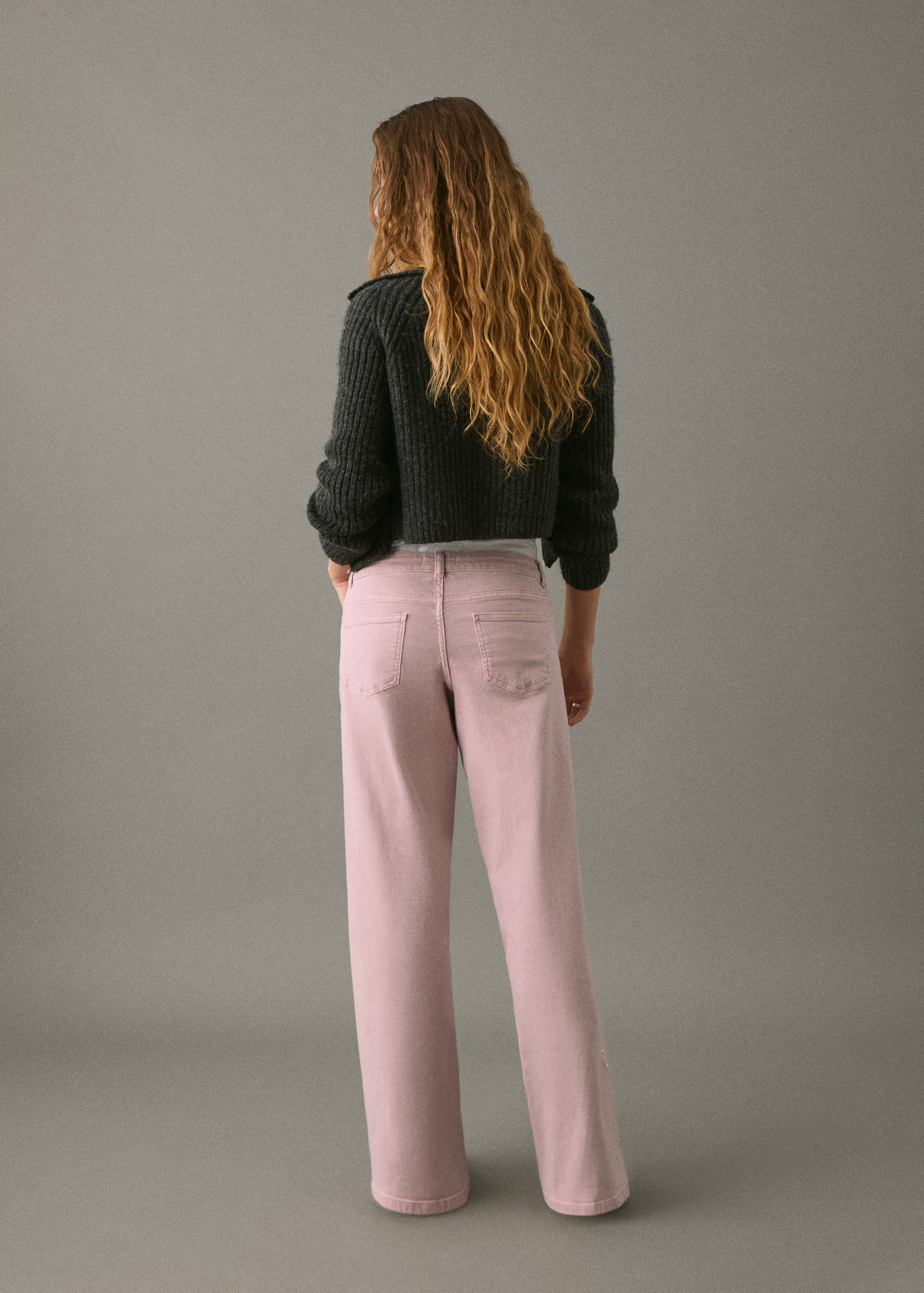 Low-waist studded jeans - Reverse of the article