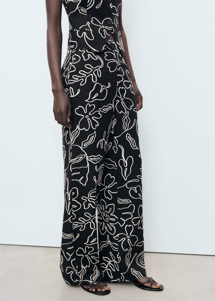 Floral-print linen-blend trousers — Black