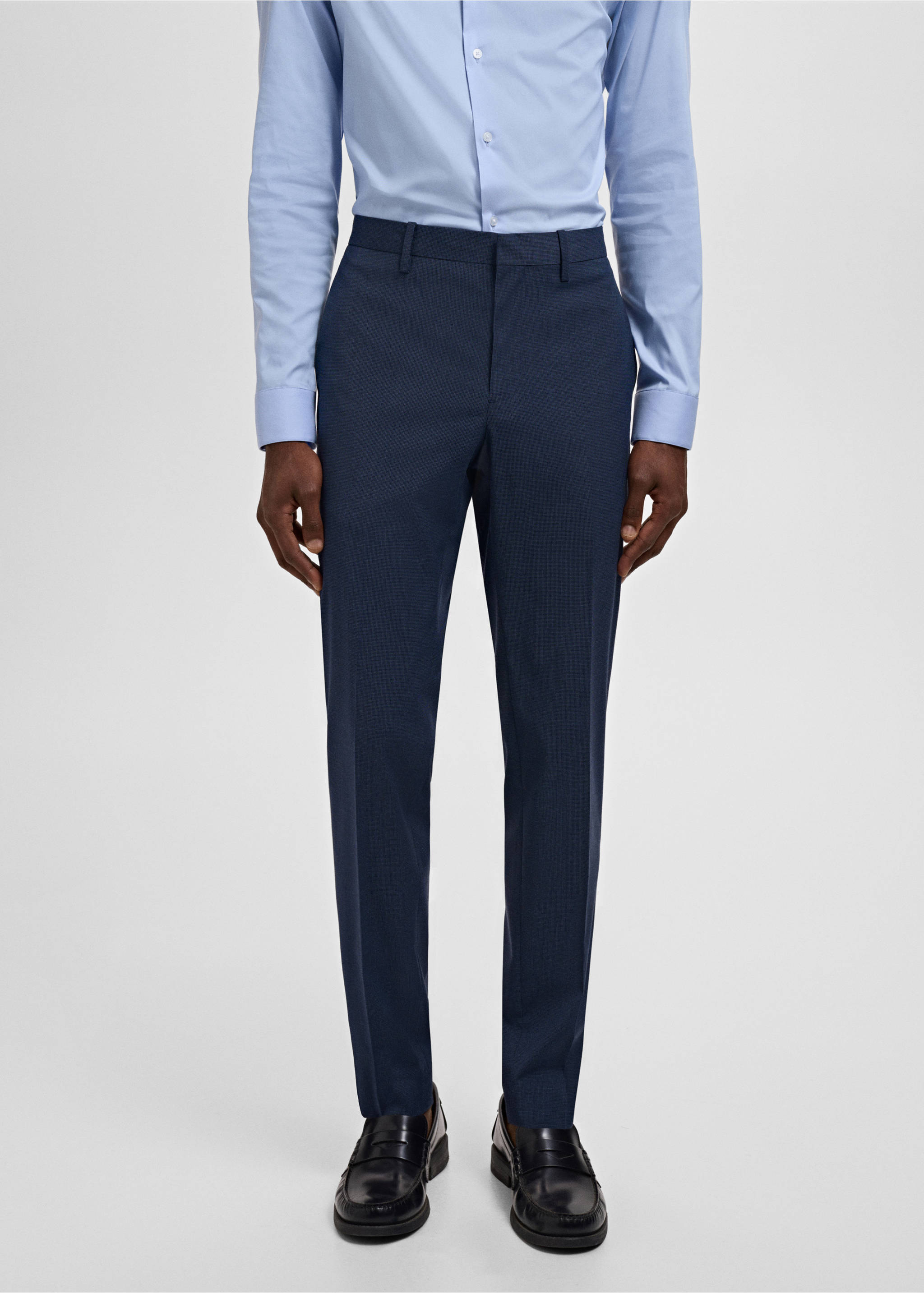 Dark navy blue tailored trousers with belt loops, worn with a light blue shirt., Ink Blue. Ref: 17021237-00.