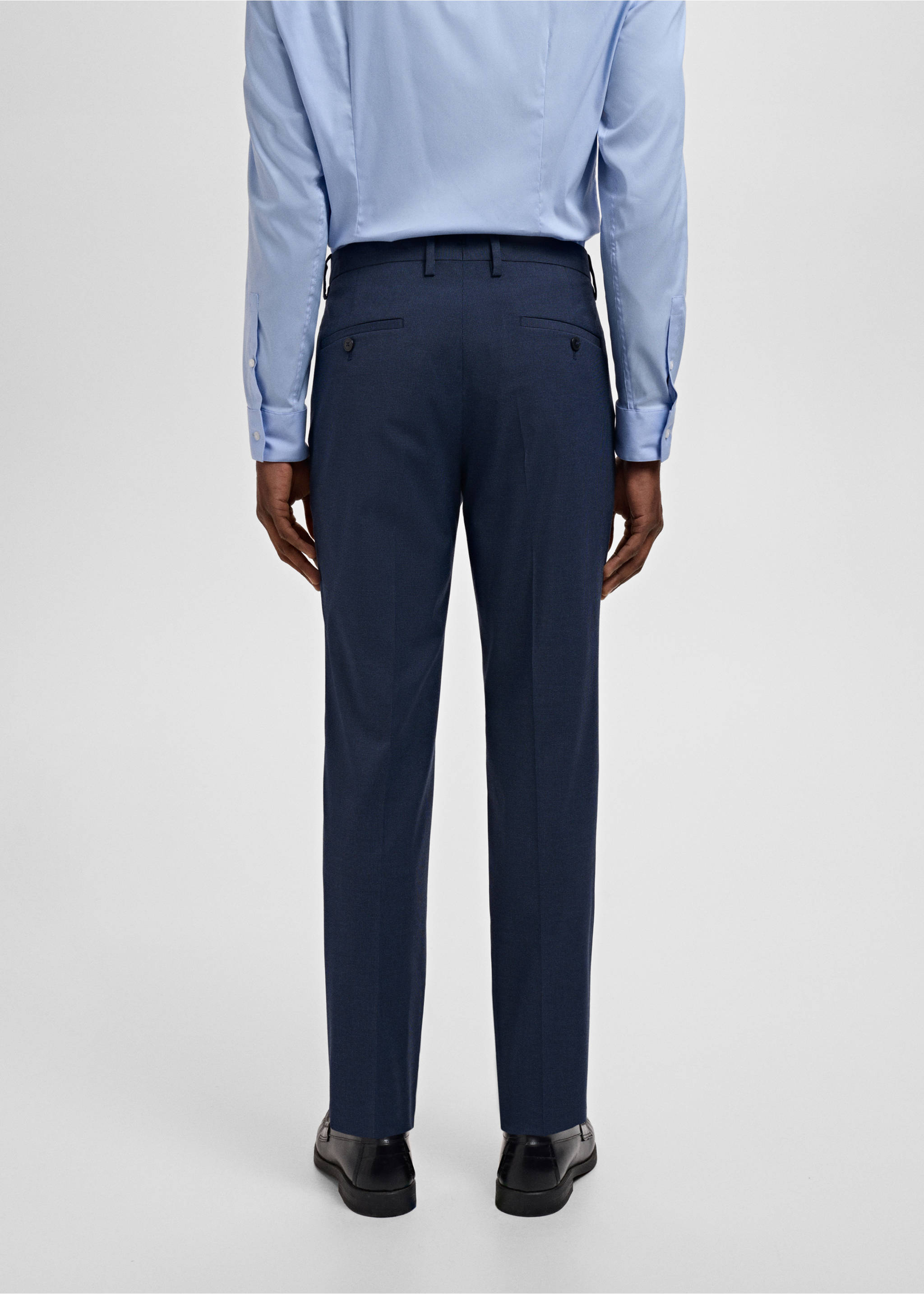Dark blue trousers with belt loops and rear welt pockets, back view., Ink Blue. Ref: 17021237-00.