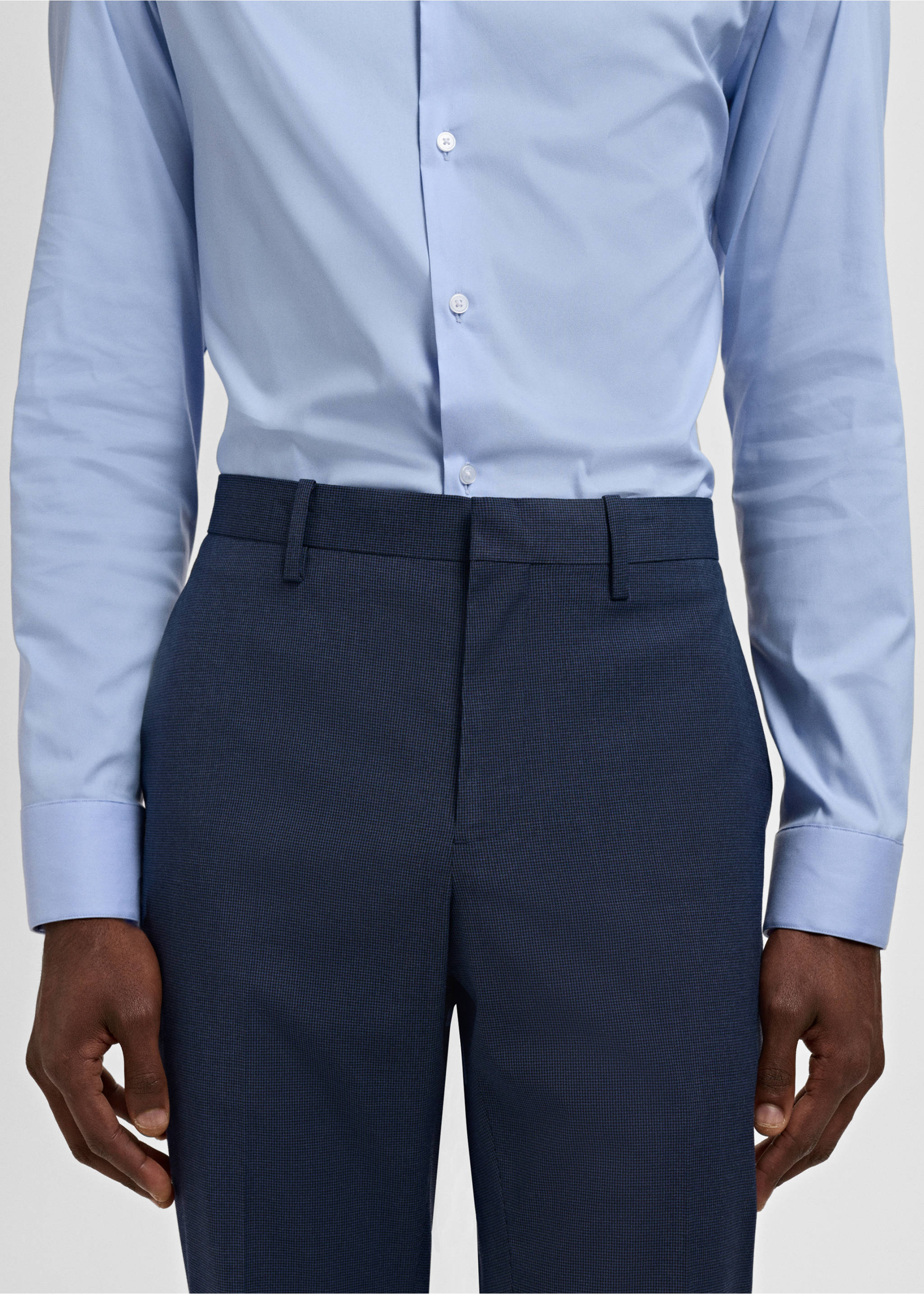 Navy blue trousers with belt loops, worn with a light blue shirt., Ink Blue. Ref: 17021237-00.