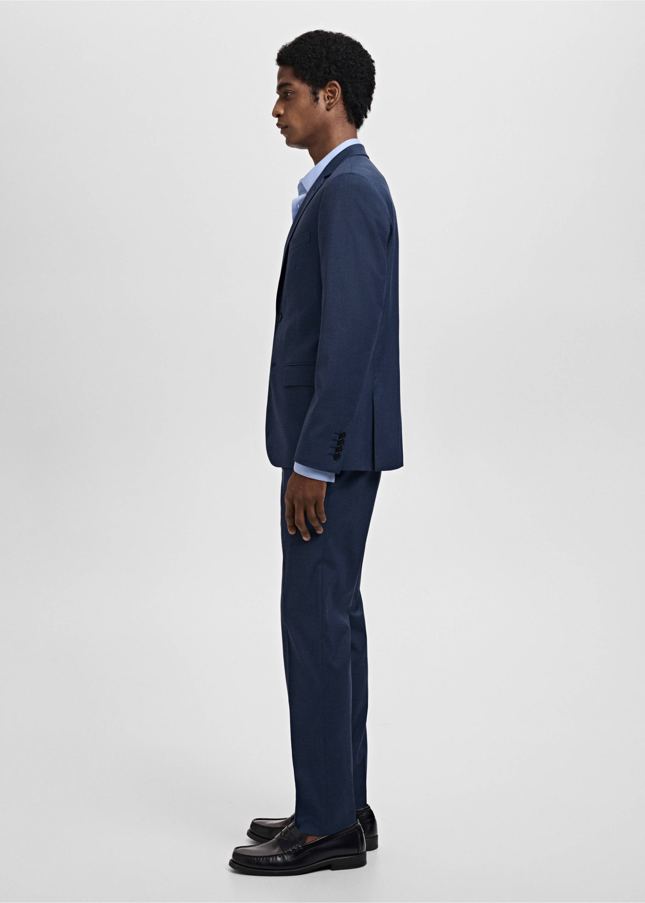 Dark blue trousers, worn with a matching suit jacket, shirt, and loafers., Ink Blue. Ref: 17021237-00.