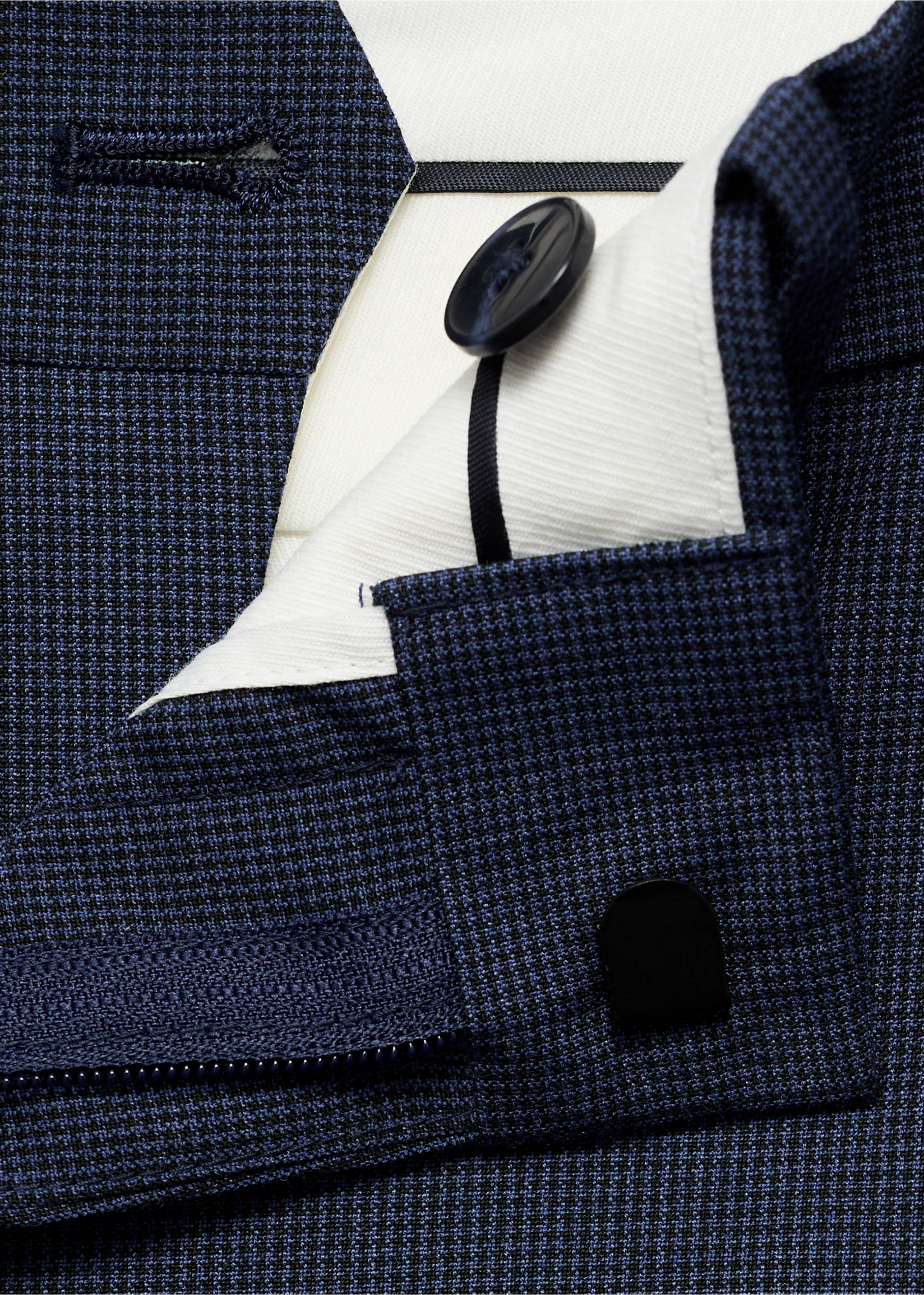 Close-up of blue micro-patterned trousers waistband and closure., Ink Blue. Ref: 17021237-00.