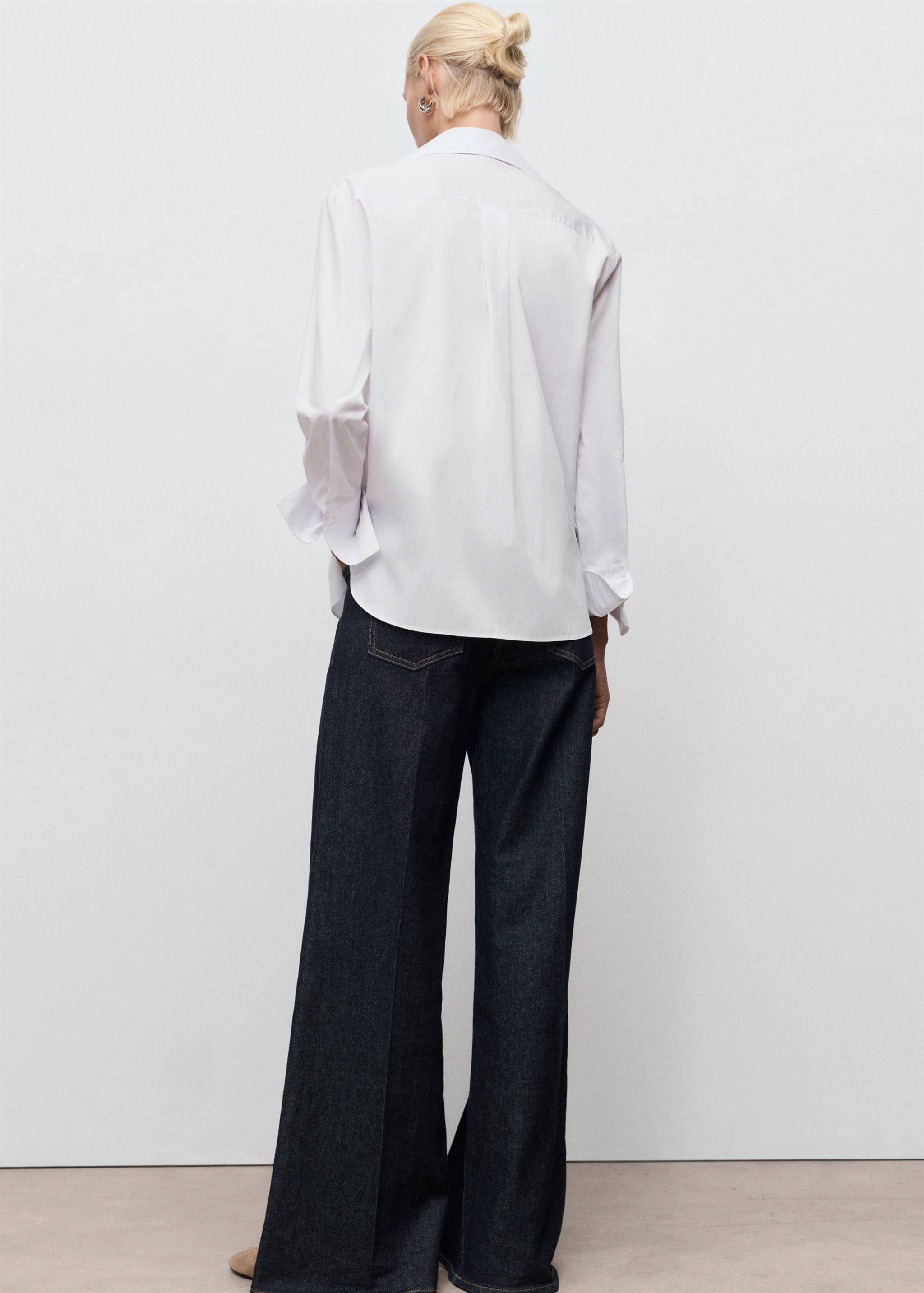 Shirt with concealed placket and collar - Reverse of the article