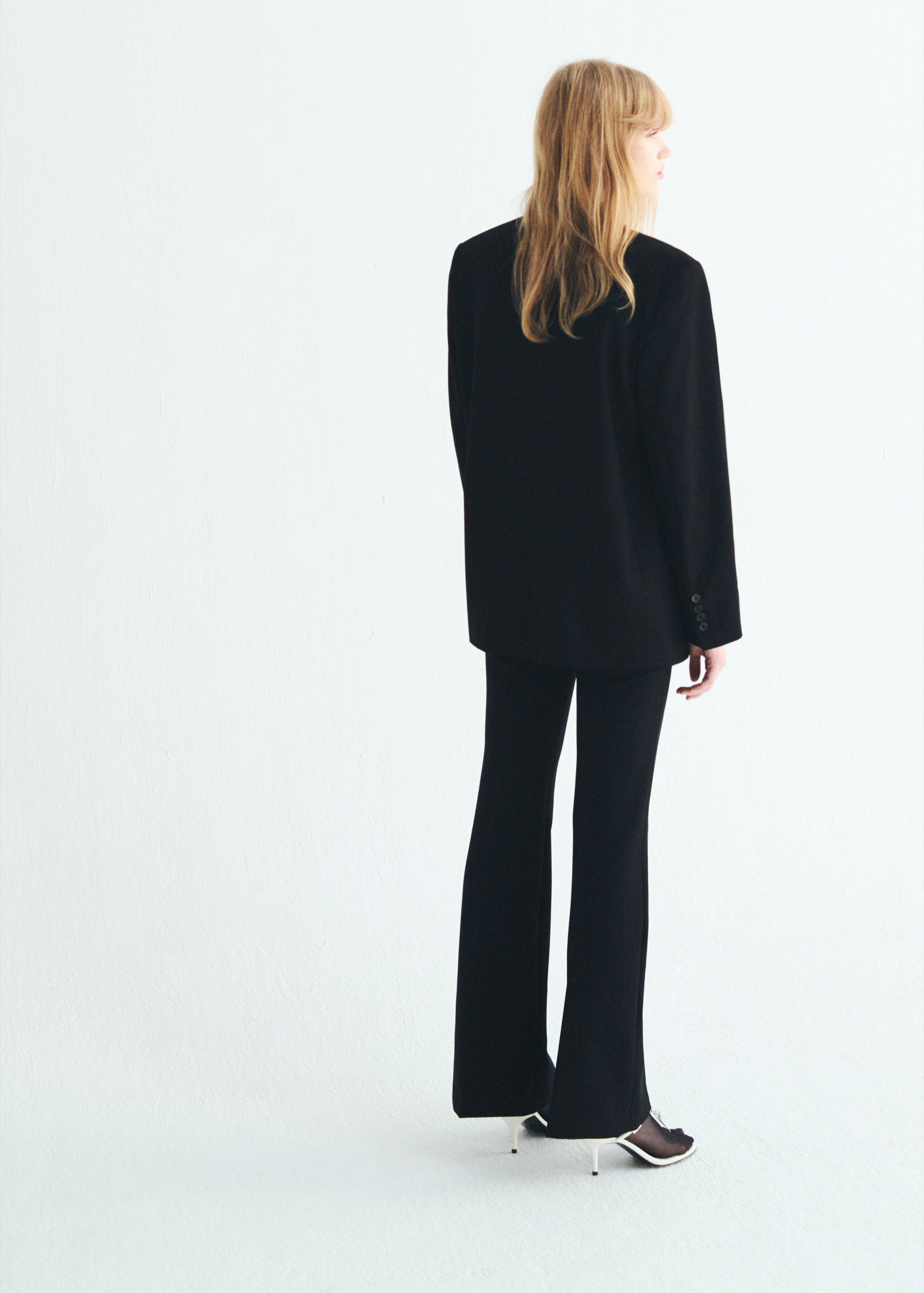 Mid-rise flare pants - Reverse of the article