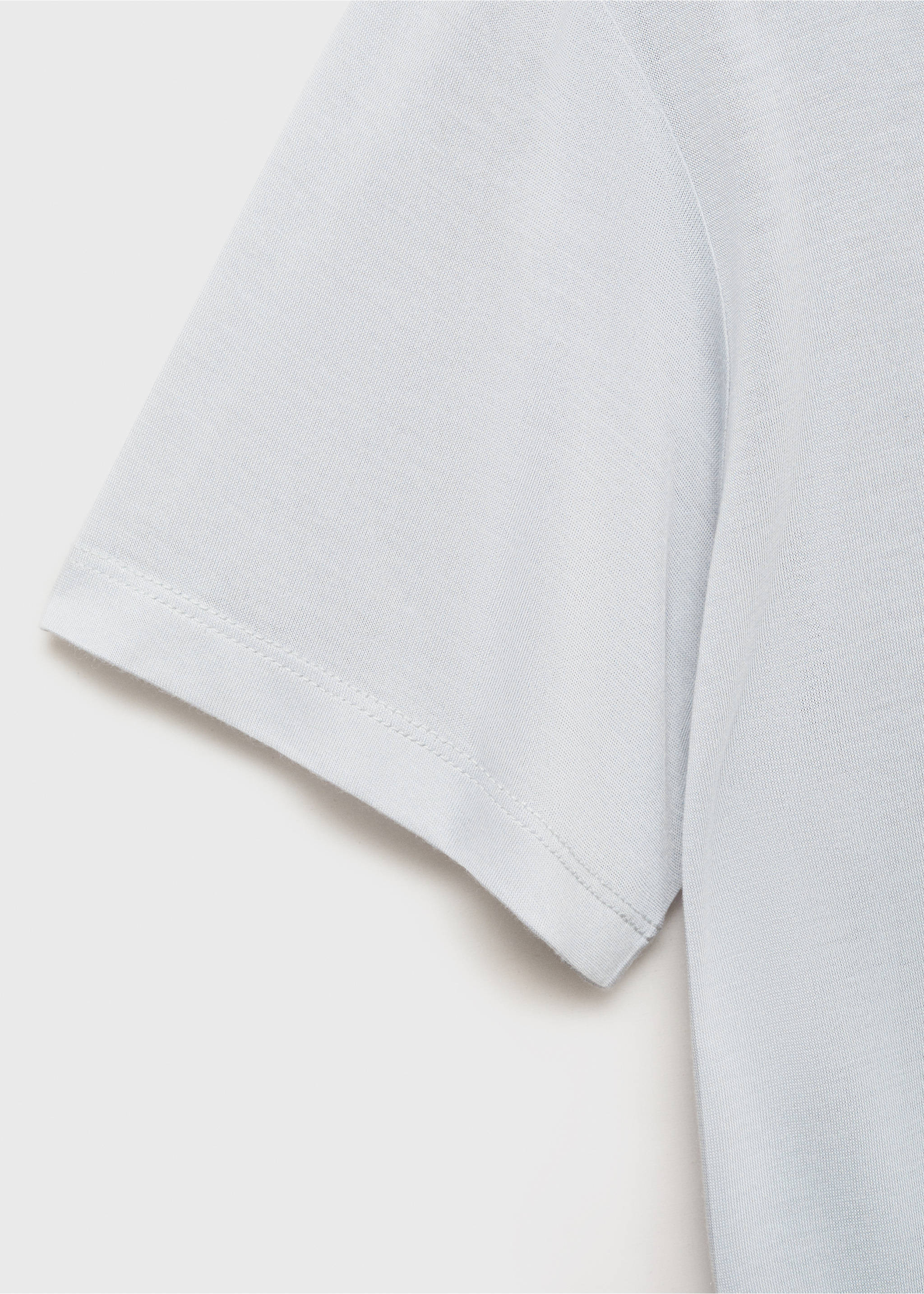 Close-up of the fabric and short sleeve of a light grey pyjama t-shirt., Light/Pastel Grey. Ref: 17034105-00.