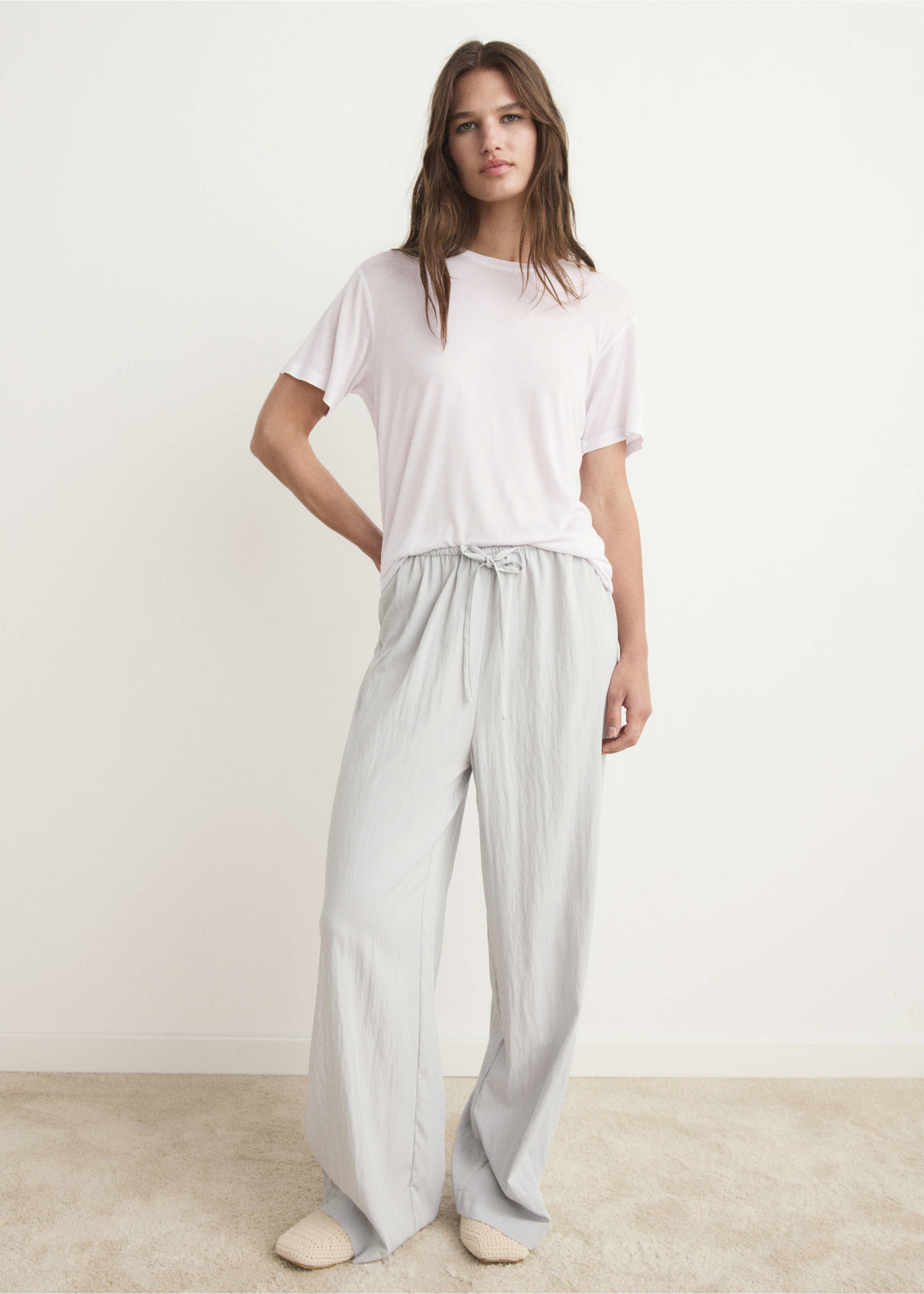 Relaxed-fit pink short-sleeved t-shirt worn with light grey wide-leg trousers., Light/Pastel Grey. Ref: 17034105-00.