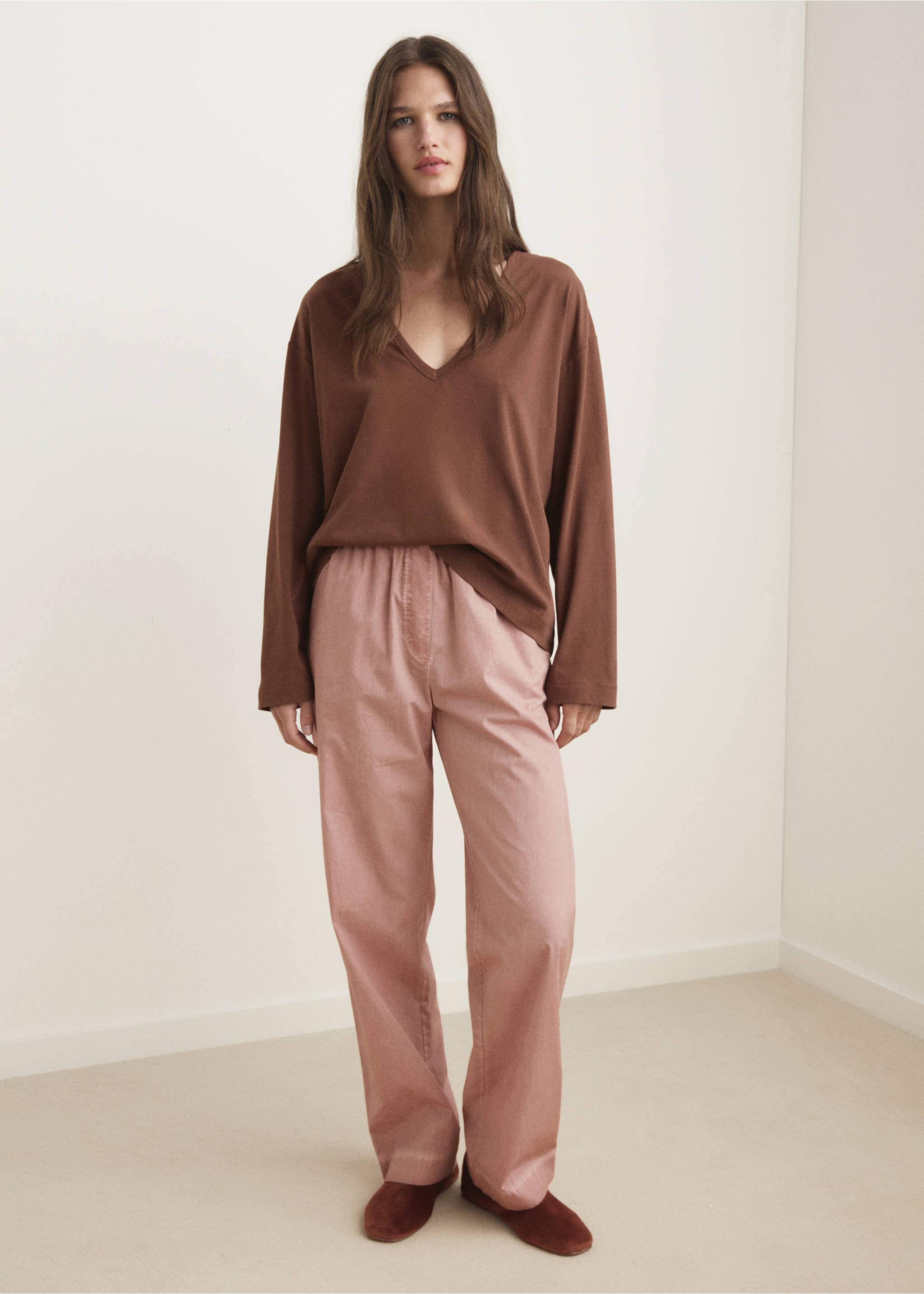 Brown long-sleeved V-neck t-shirt in a relaxed fit, worn with pink trousers., Brown. Ref: 17034112-00.