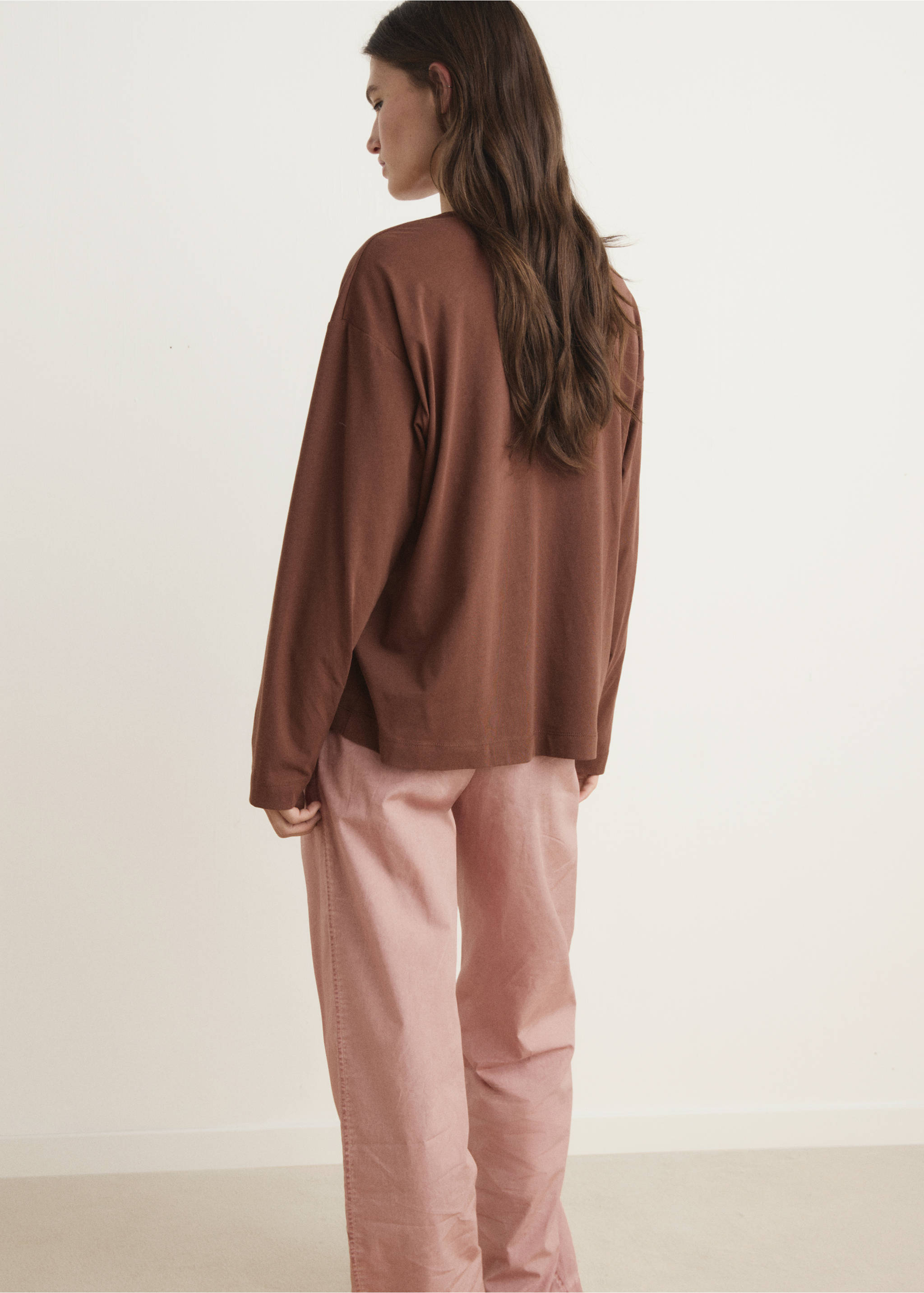 Brown long-sleeved t-shirt in a relaxed fit, shown from the back with pink trousers., Brown. Ref: 17034112-00.