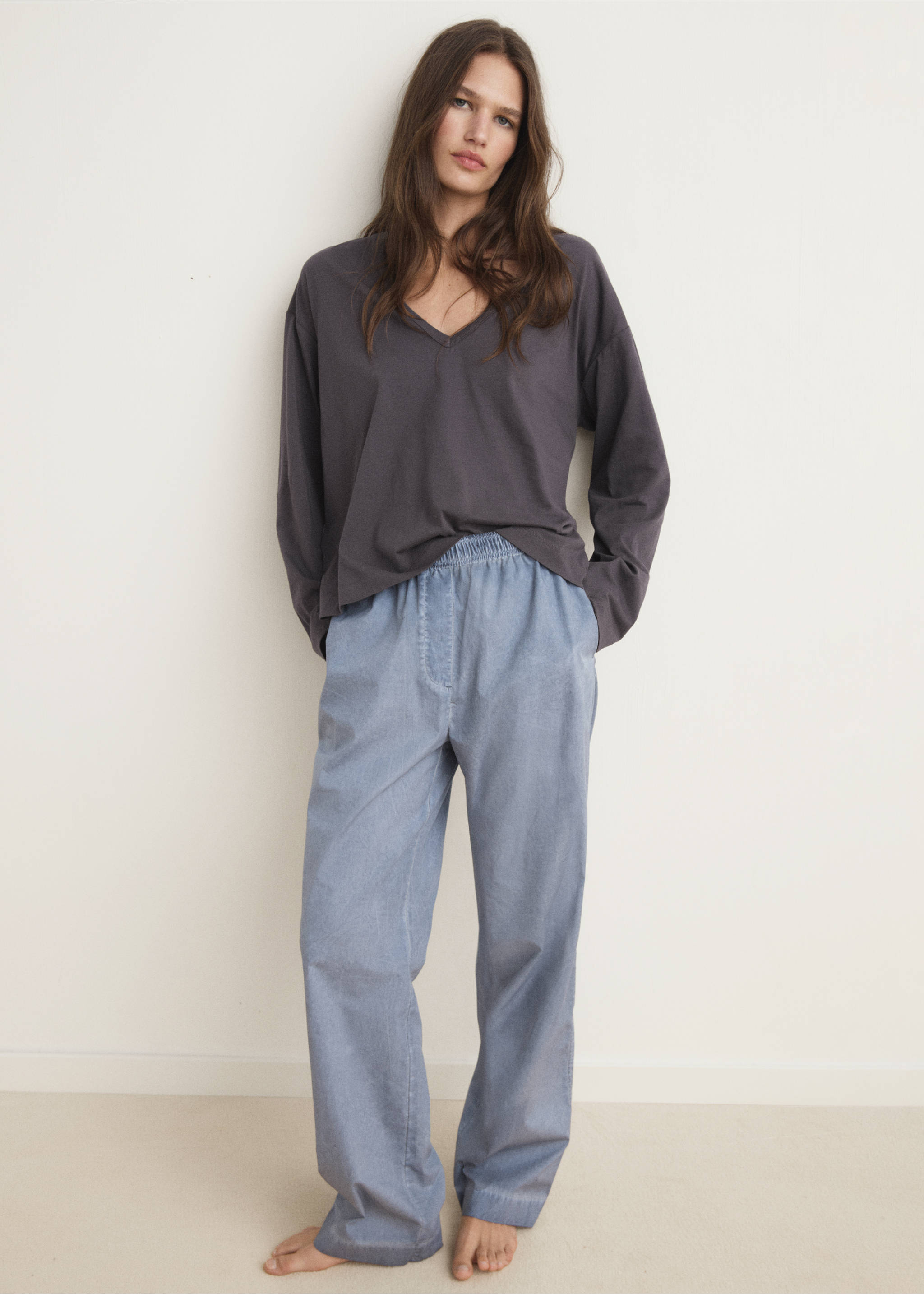 Charcoal grey V-neck long-sleeved t-shirt worn with blue trousers, Charcoal. Ref: 17034112-00.