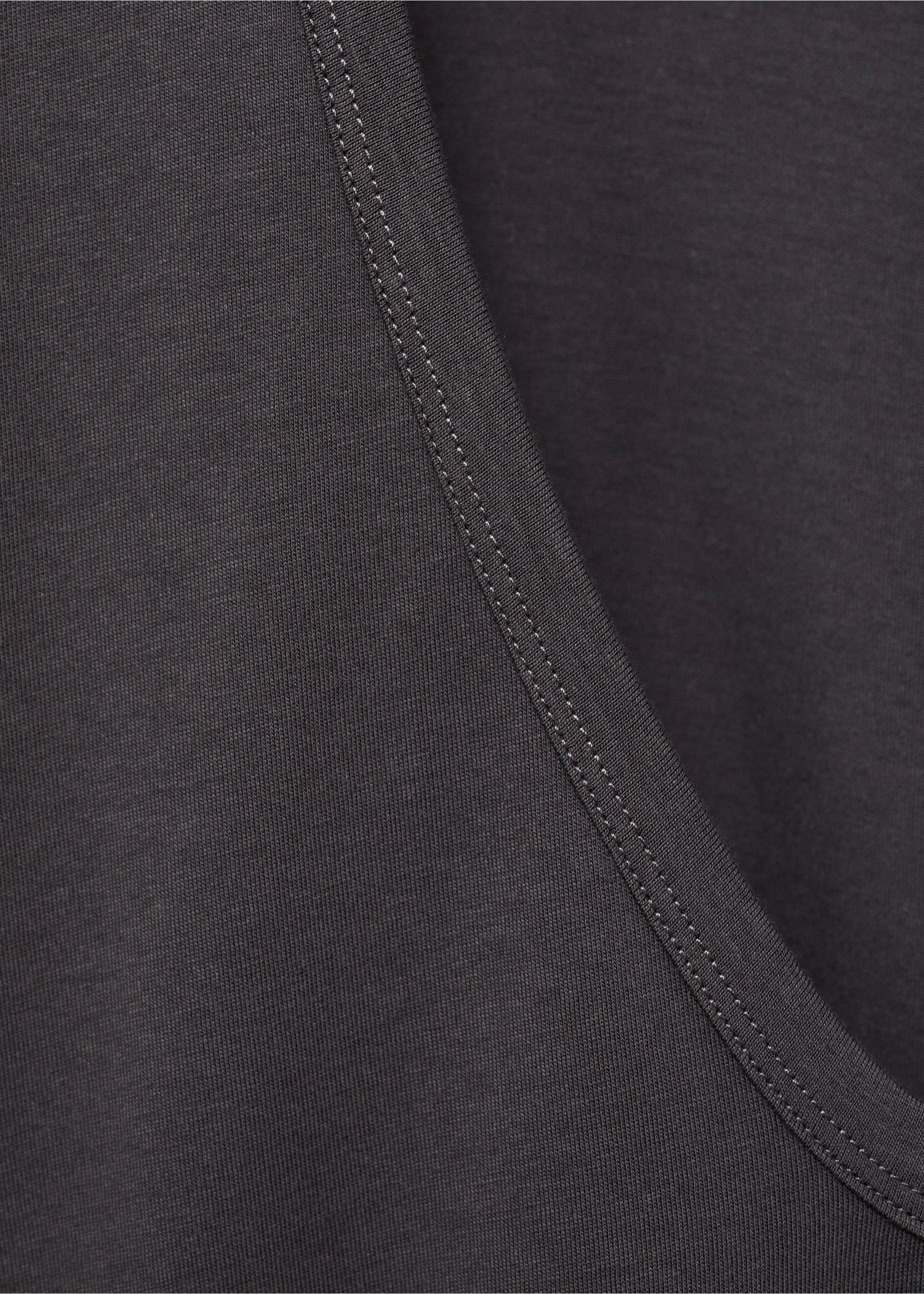 Close-up of the dark grey pyjama top fabric and ribbed neckline., Charcoal. Ref: 17034112-00.