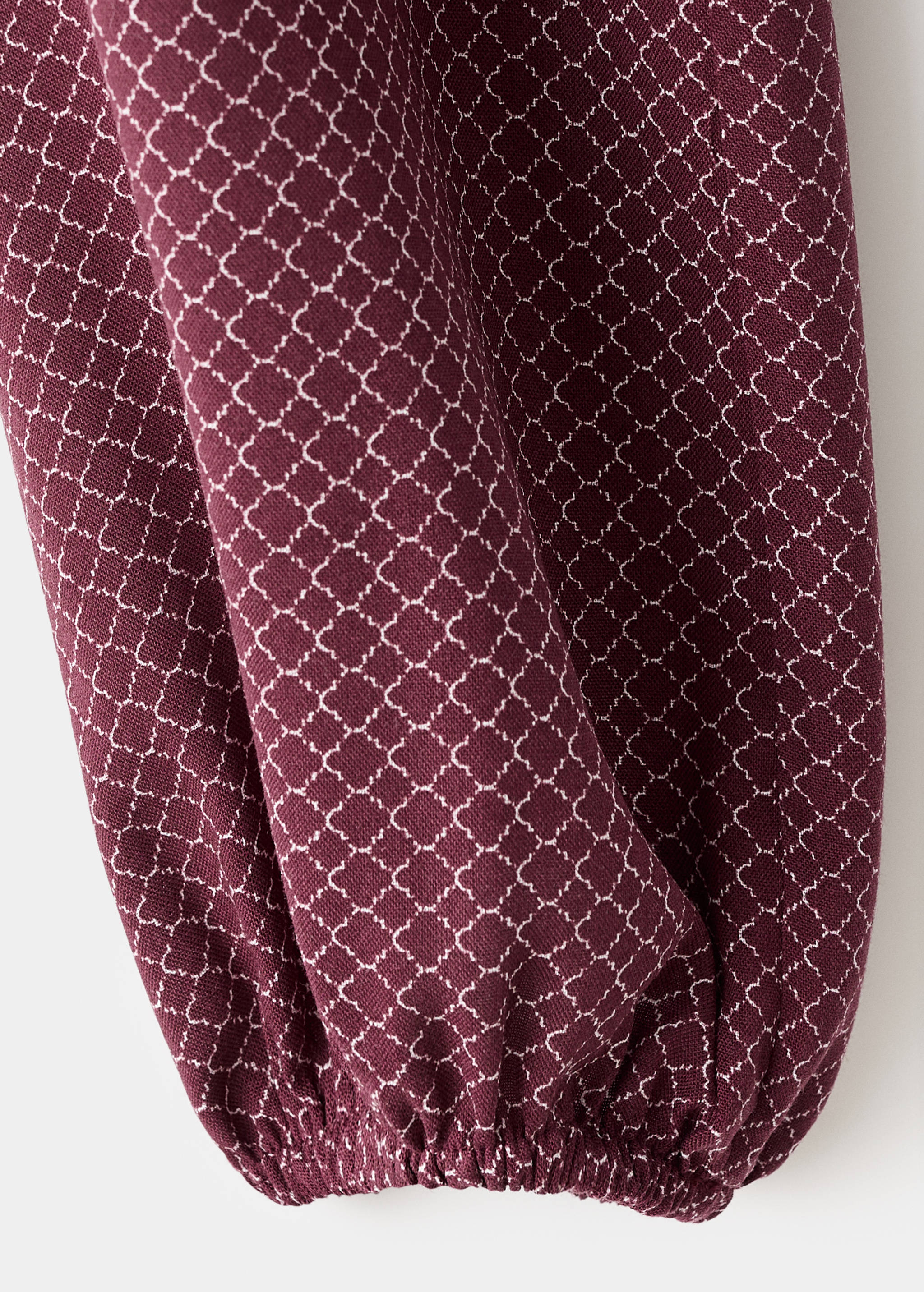 Блуза з об'ємними рукавами та вузлом - Детальніше про товар 0