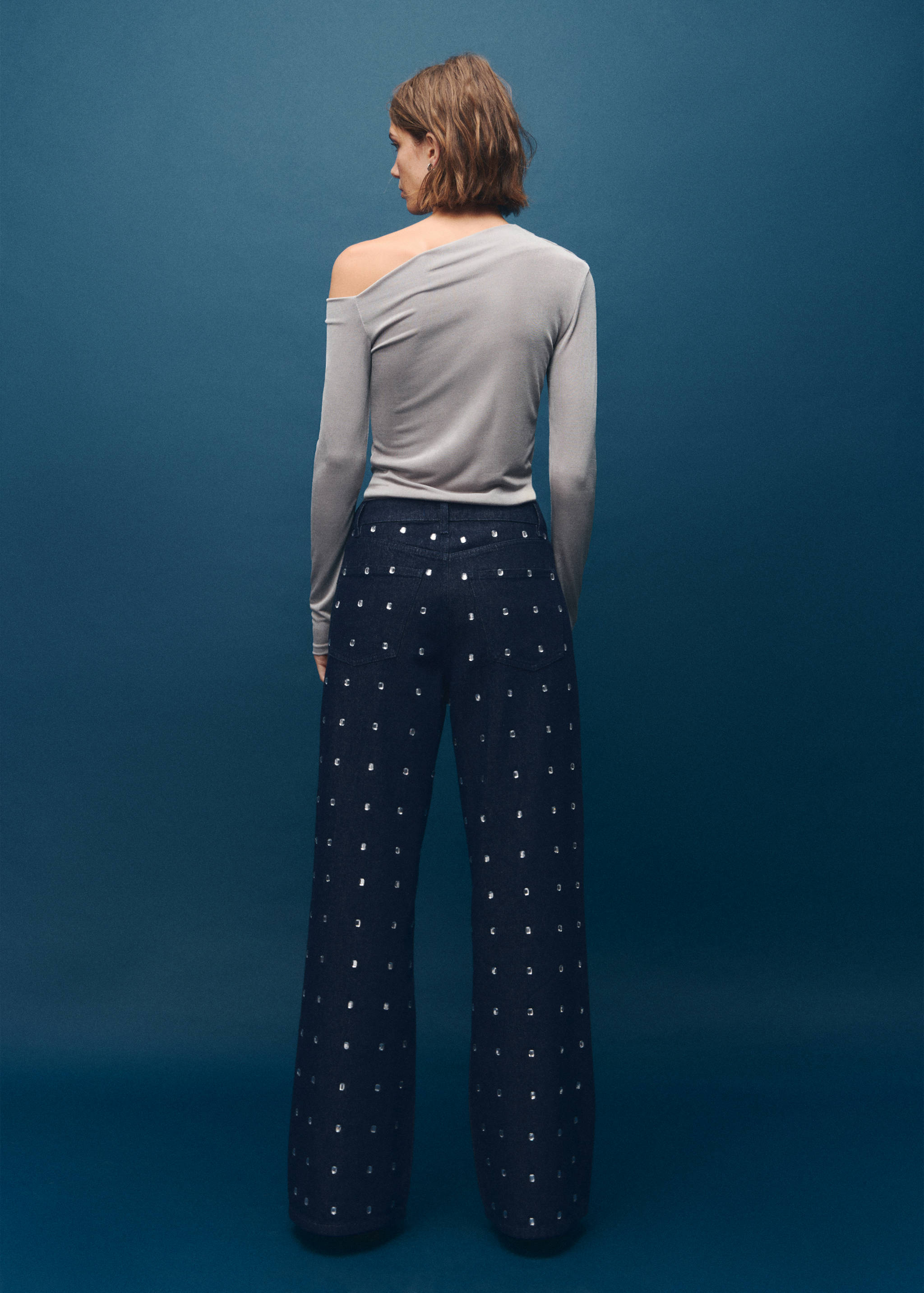 Wide leg jeans with crystals - Reverse of the article