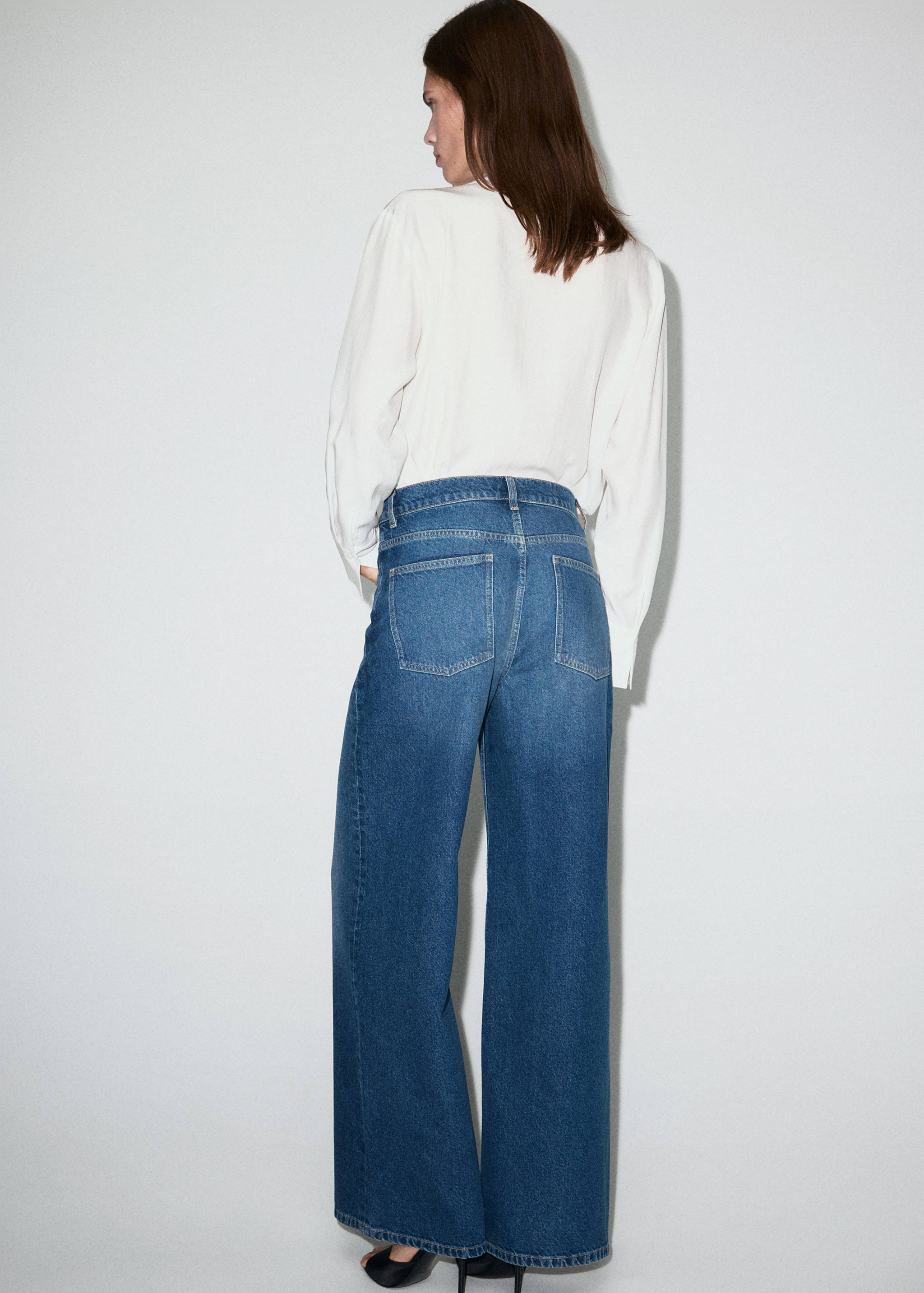 Wide leg mid-rise jeans with a crossover waistband - Reverse of the article