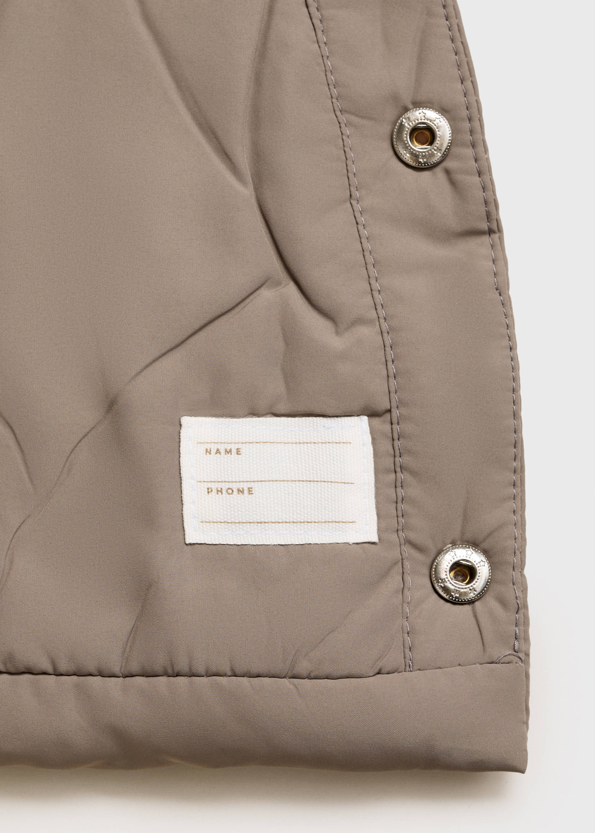 Quilted coat with ear flaps - Details of the article 0