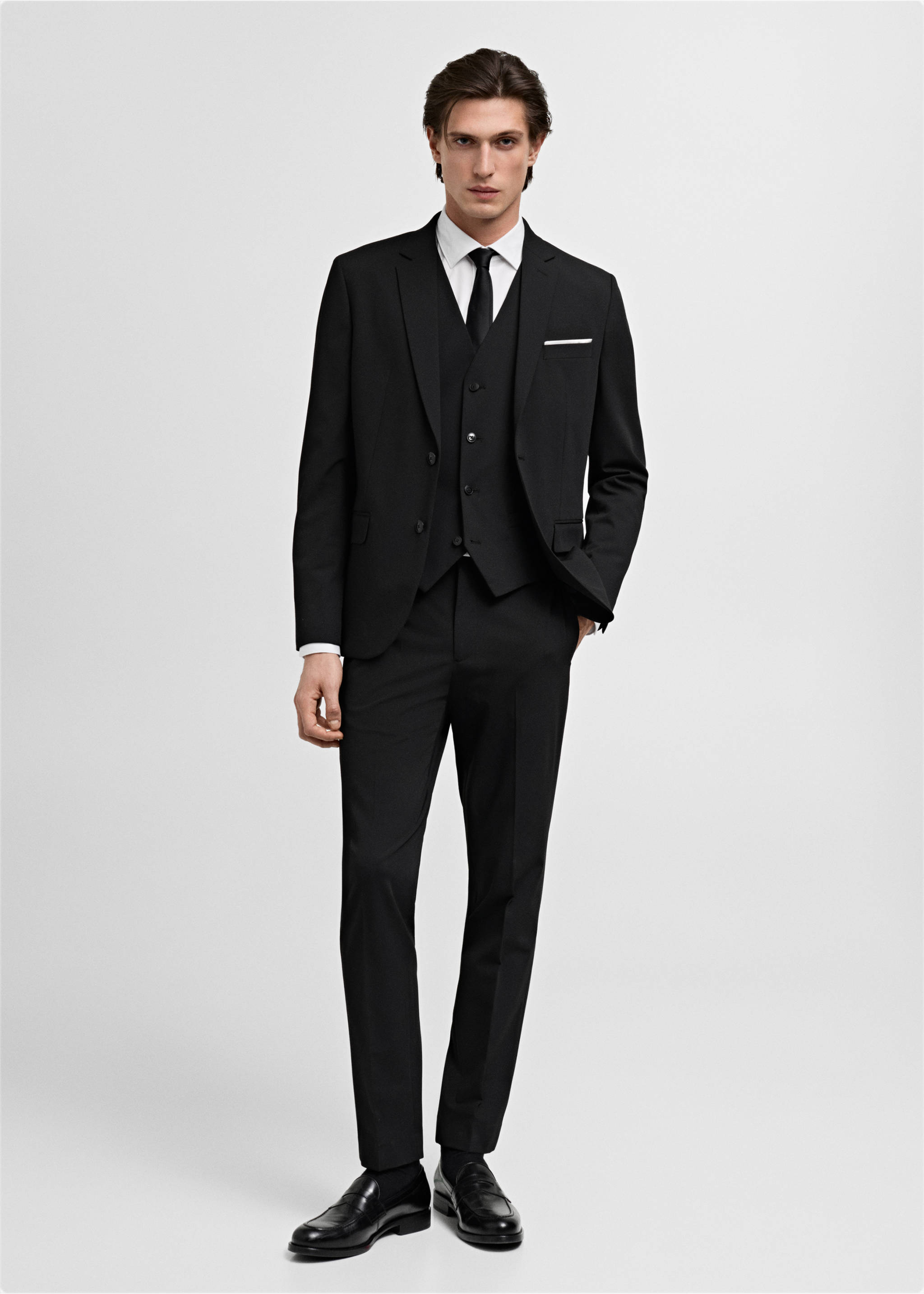 Black waistcoat worn with a matching suit, white shirt, and tie., Black. Ref: 17051236-00.