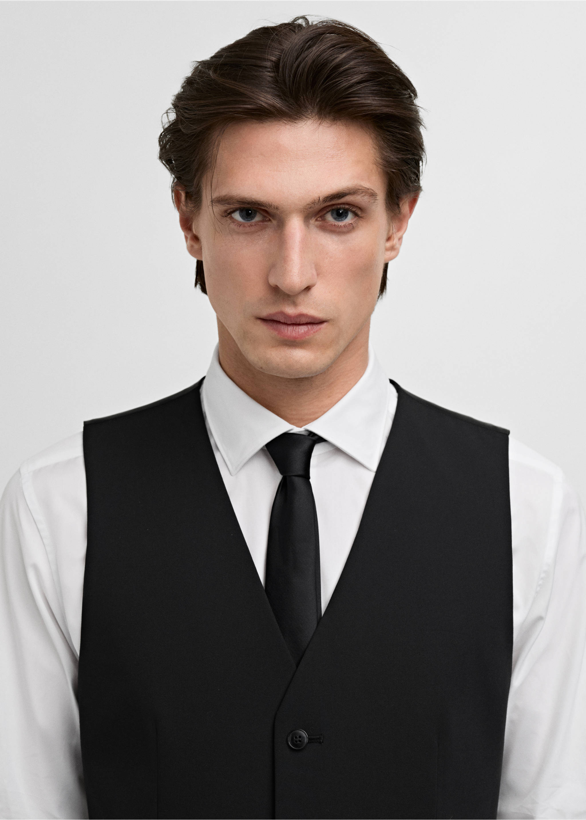 Black waistcoat worn over a white shirt and black tie., Black. Ref: 17051236-00.