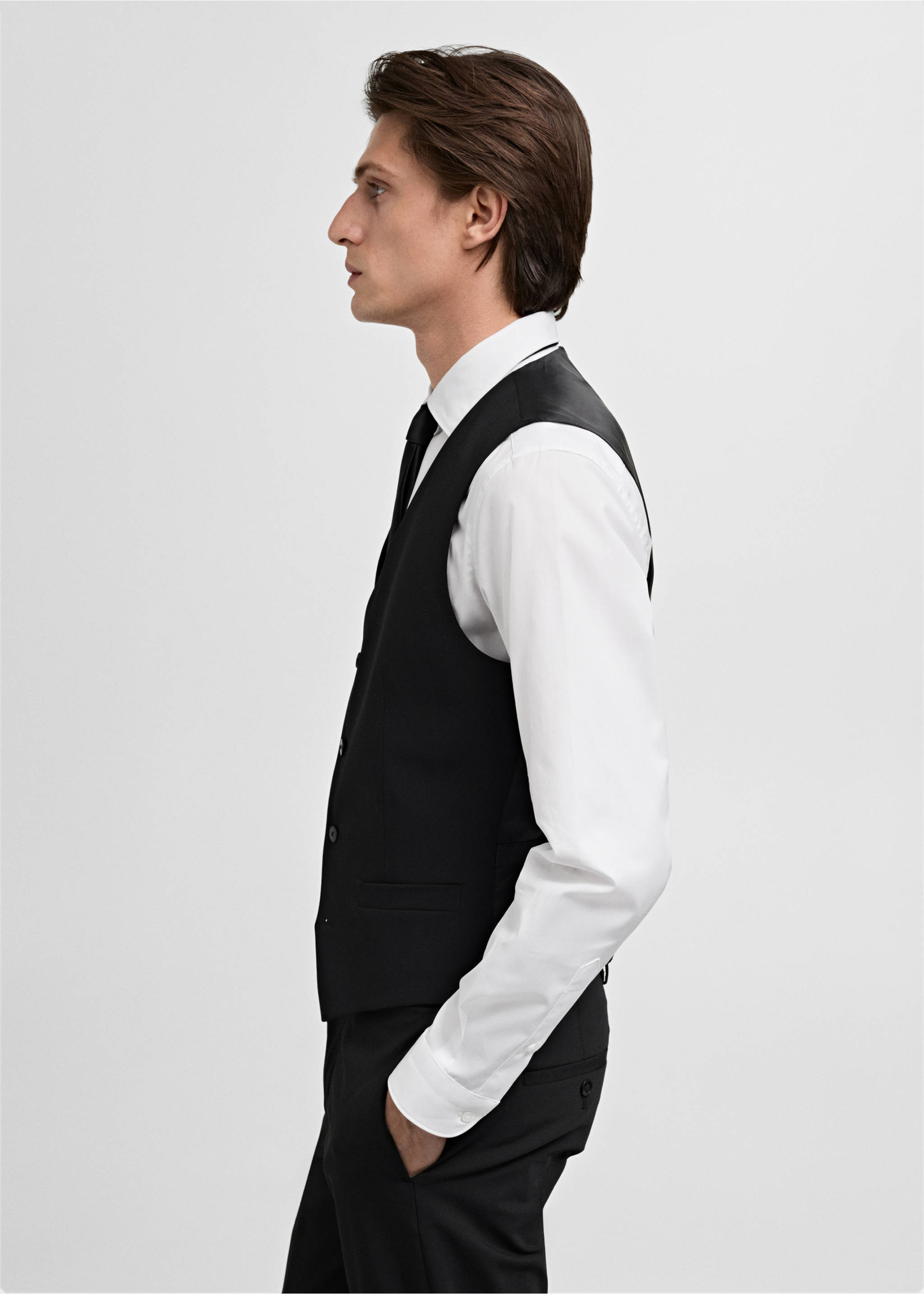 Black suit vest worn over a white shirt and black tie., Black. Ref: 17051236-00.