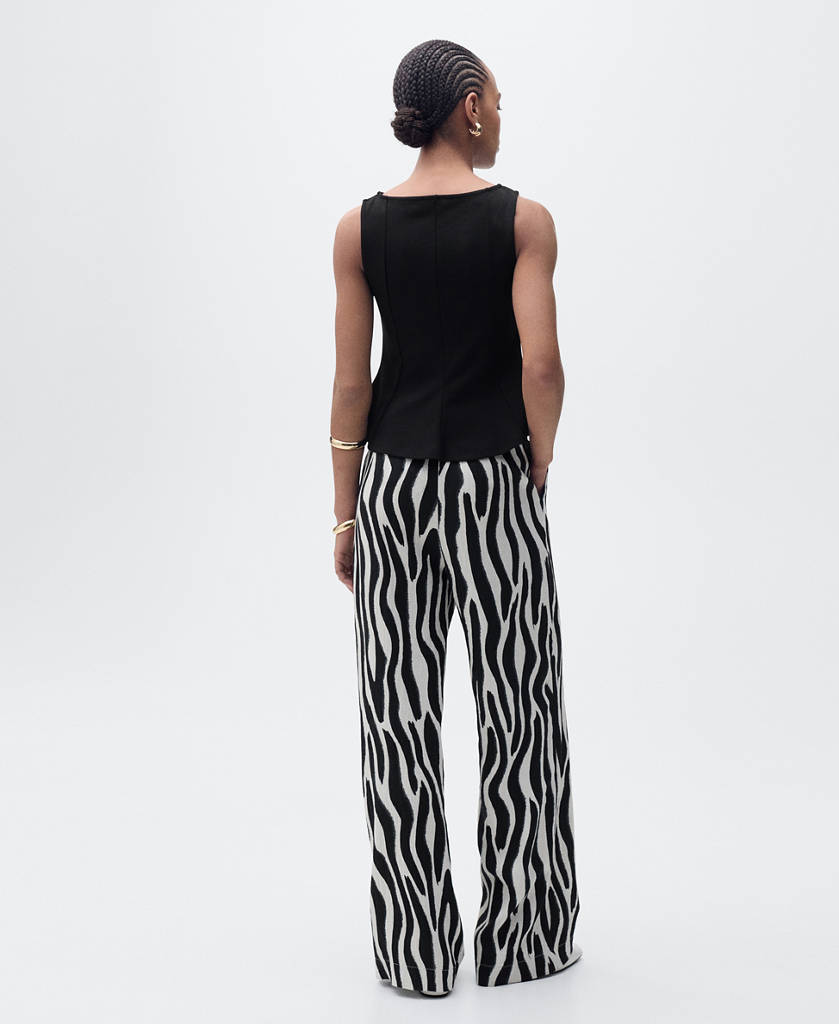 Peplum top with seam detail — Black