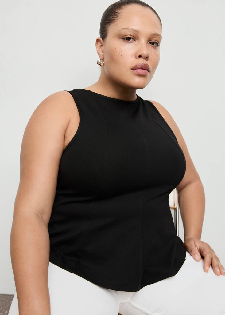 Peplum top with seam detail — Black