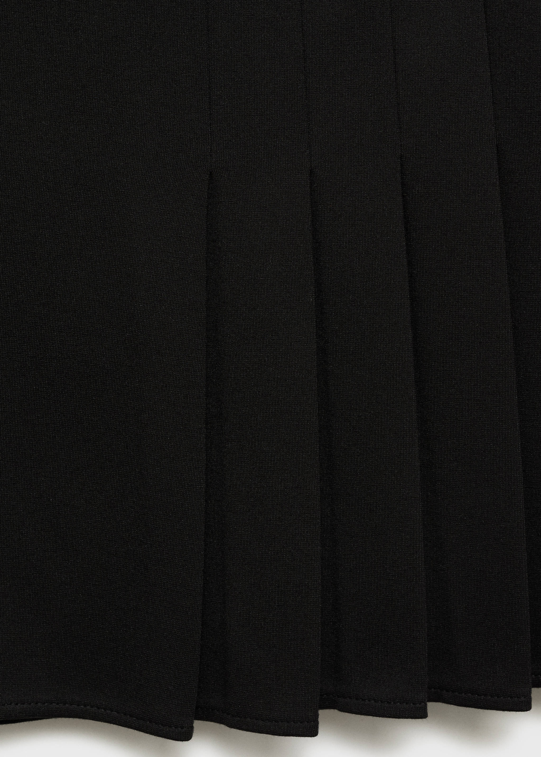 Geplooide minirok - Detail van het artikel 8