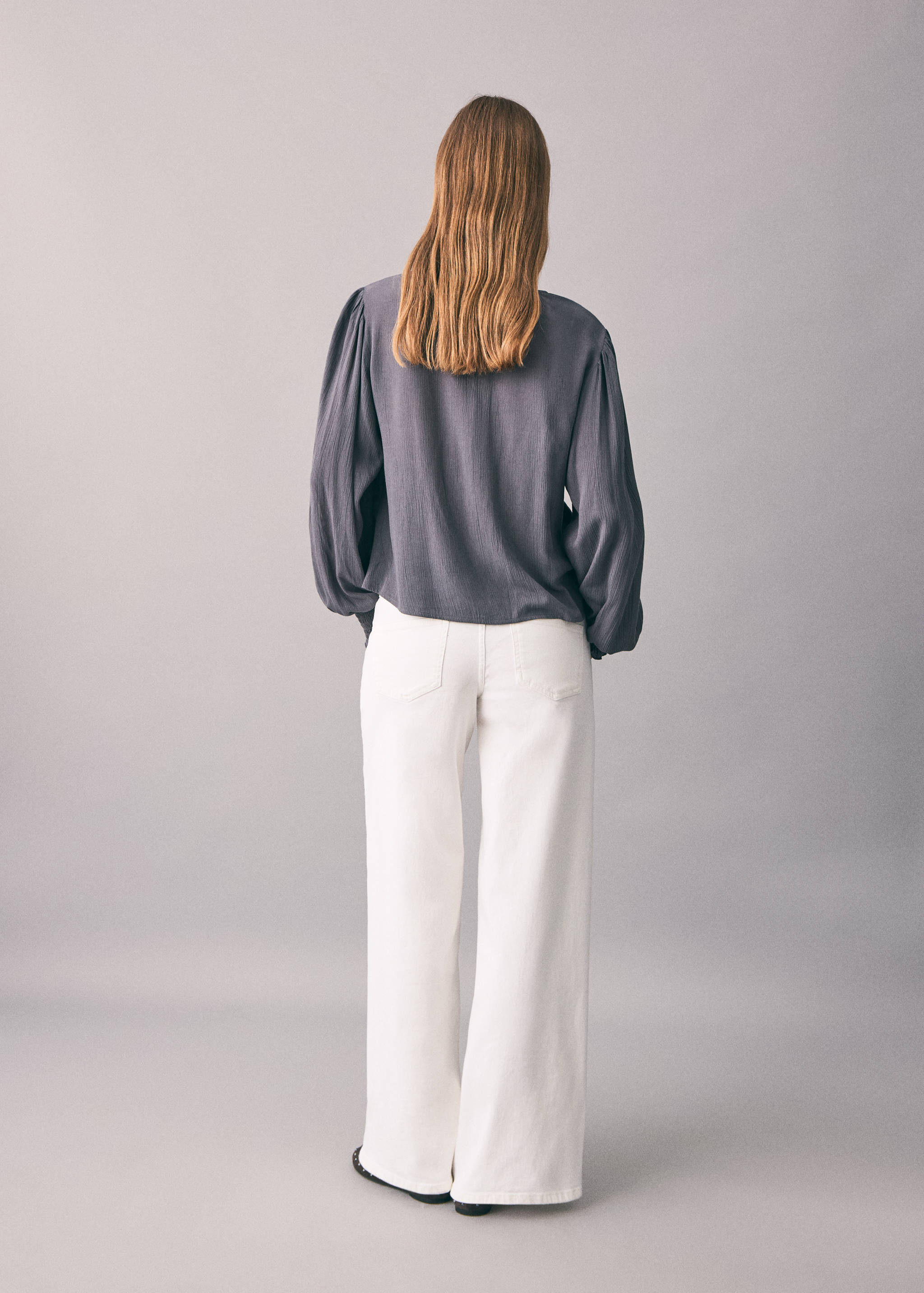 Low-waist studded jeans - Reverse of the article