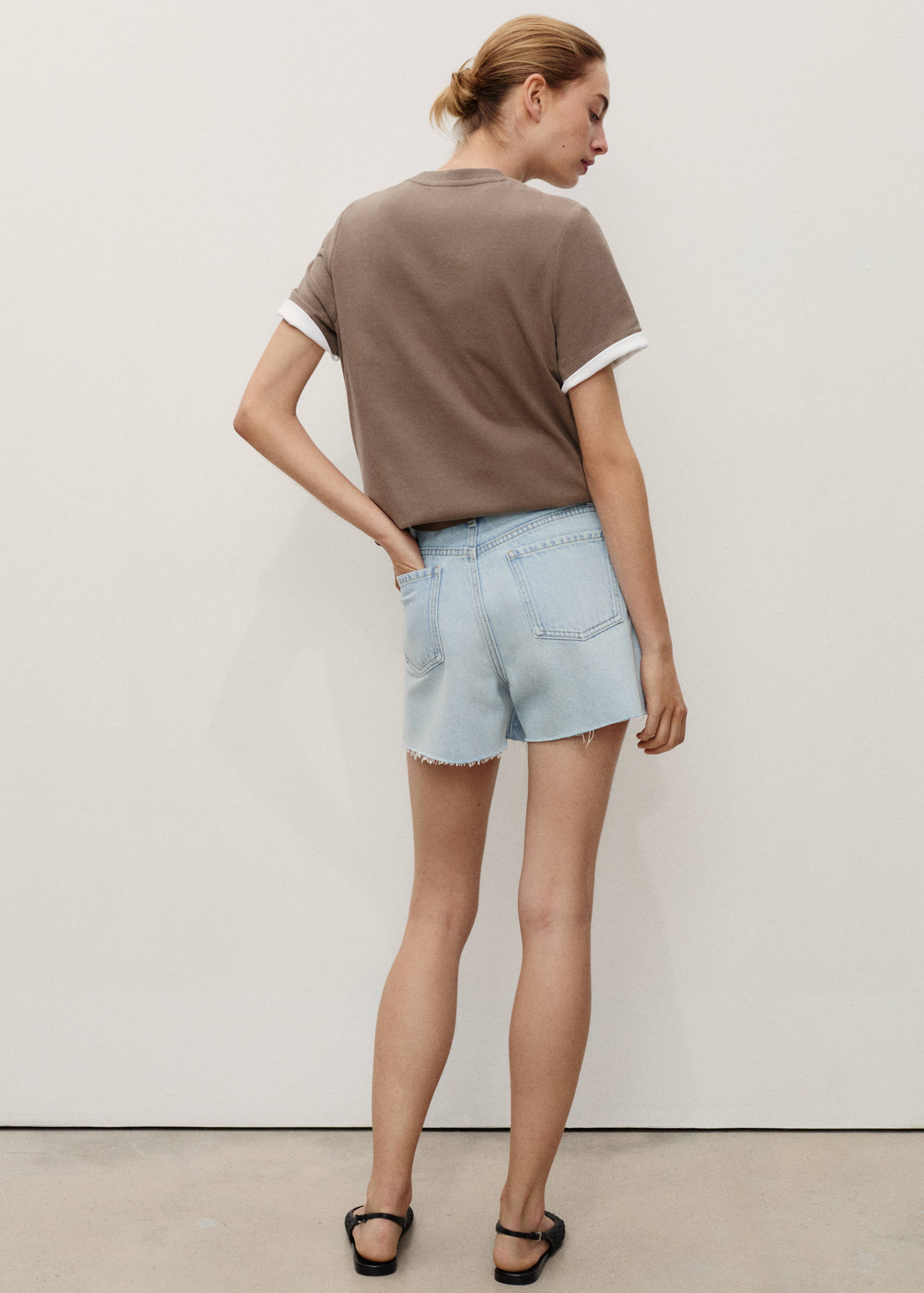 Denim shorts with frayed hem - Reverse of the article