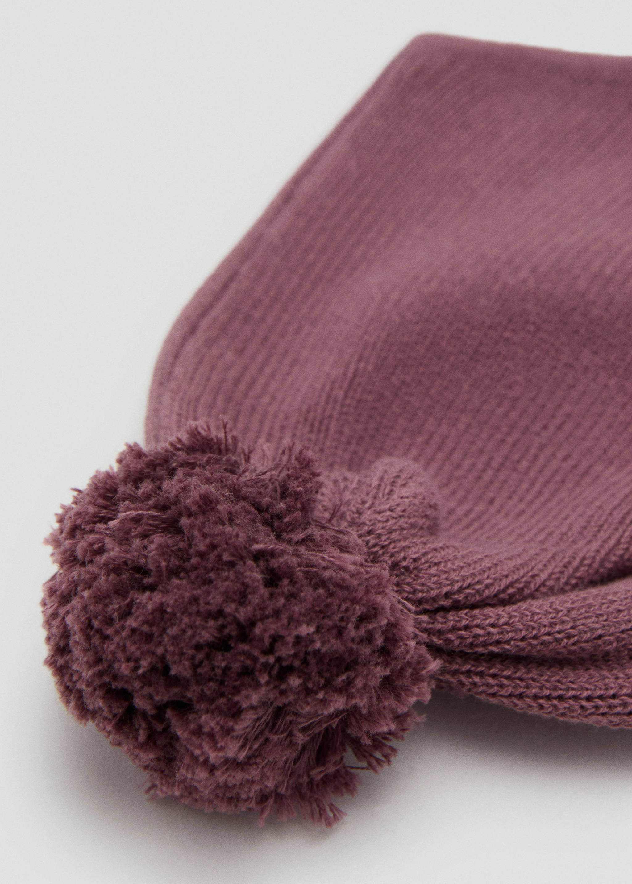 Knitted bonnet with tassel - Details of the article 1