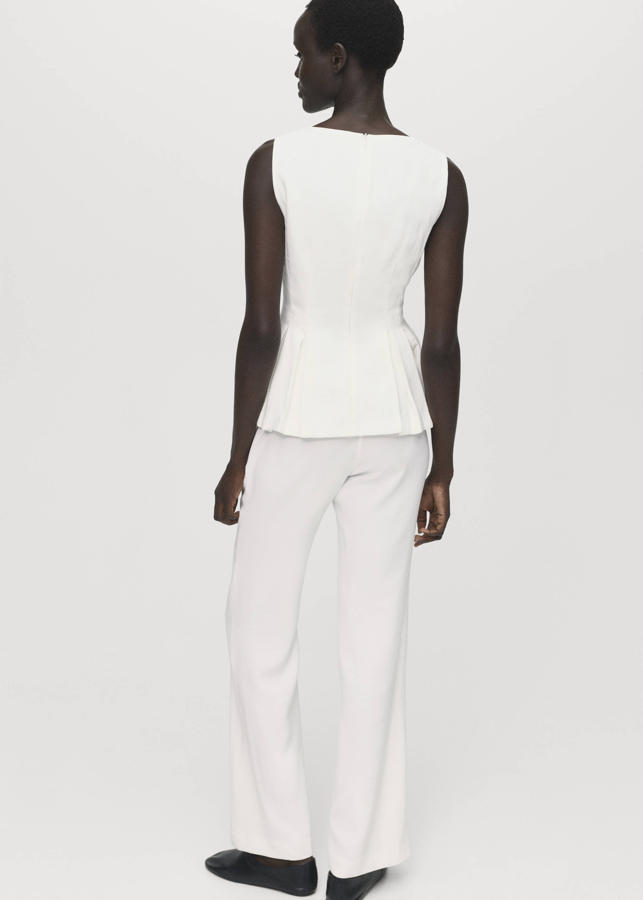 Peplum top with pleat detail - Reverse of the article