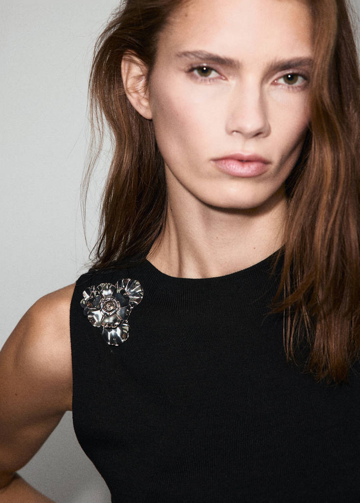 Knitted top with metallic flower — Black