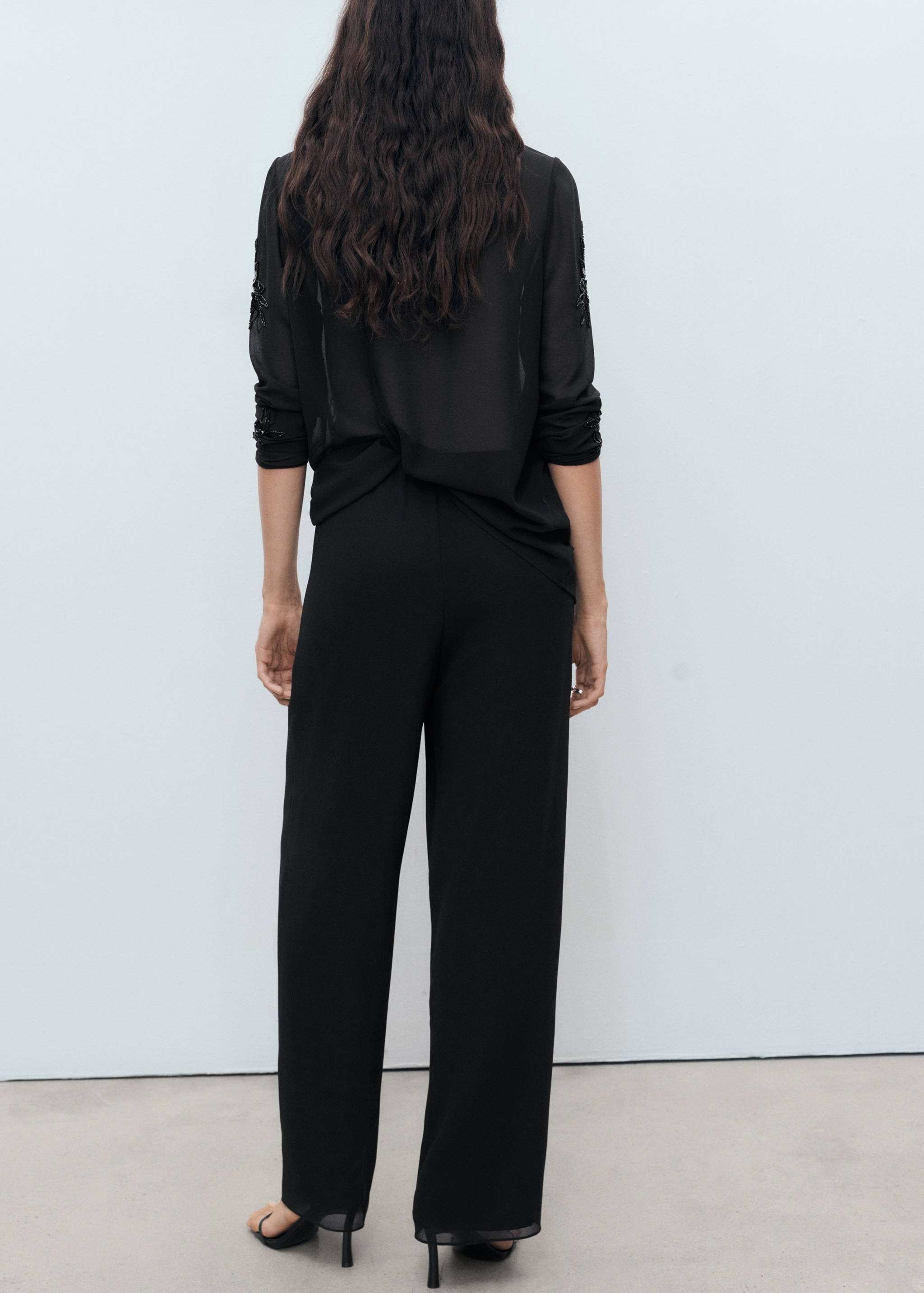 Rhinestone-embroidered trousers - Reverse of the article