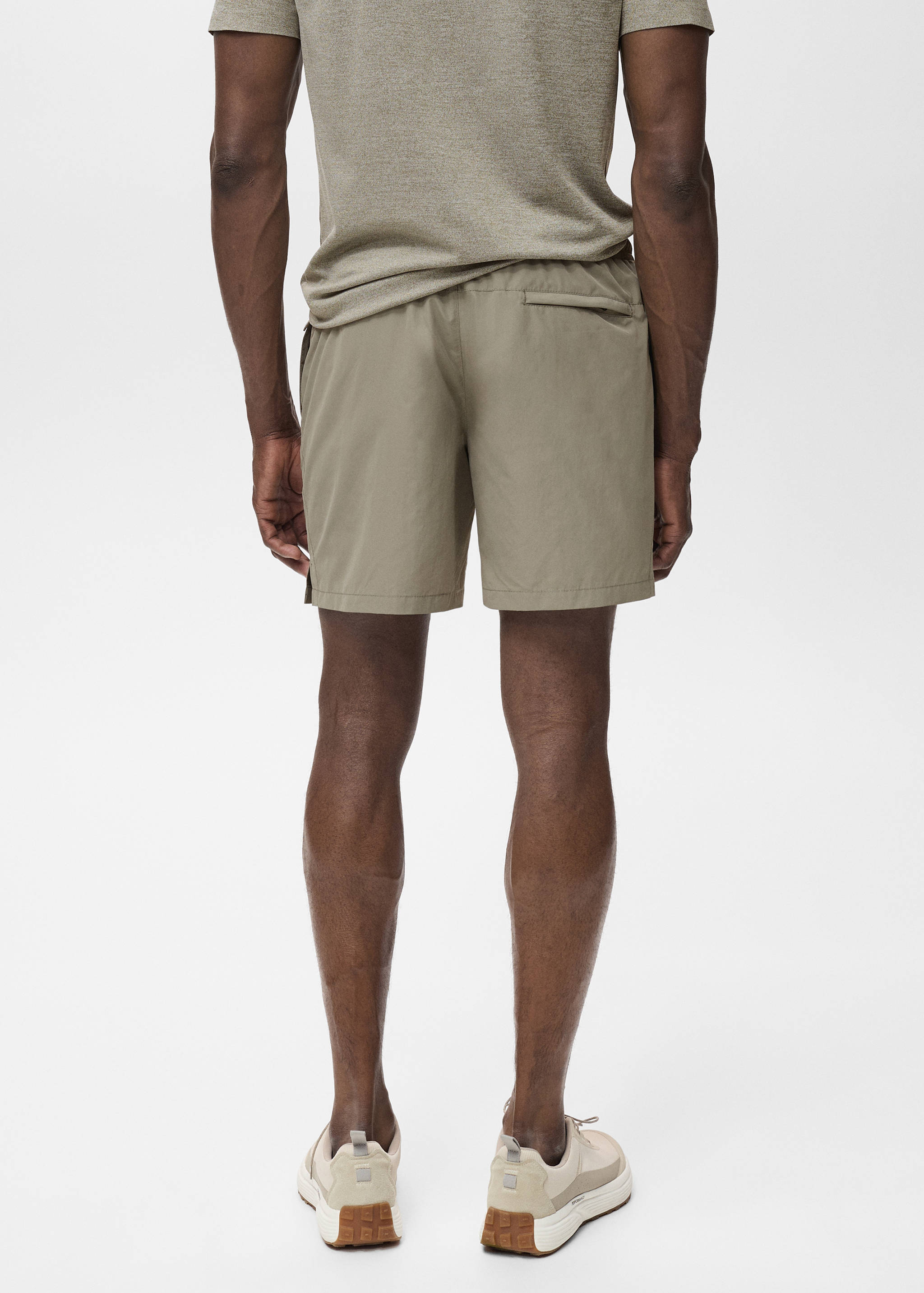 Badbyxa med fickor med dragkedja - Artikelns baksida