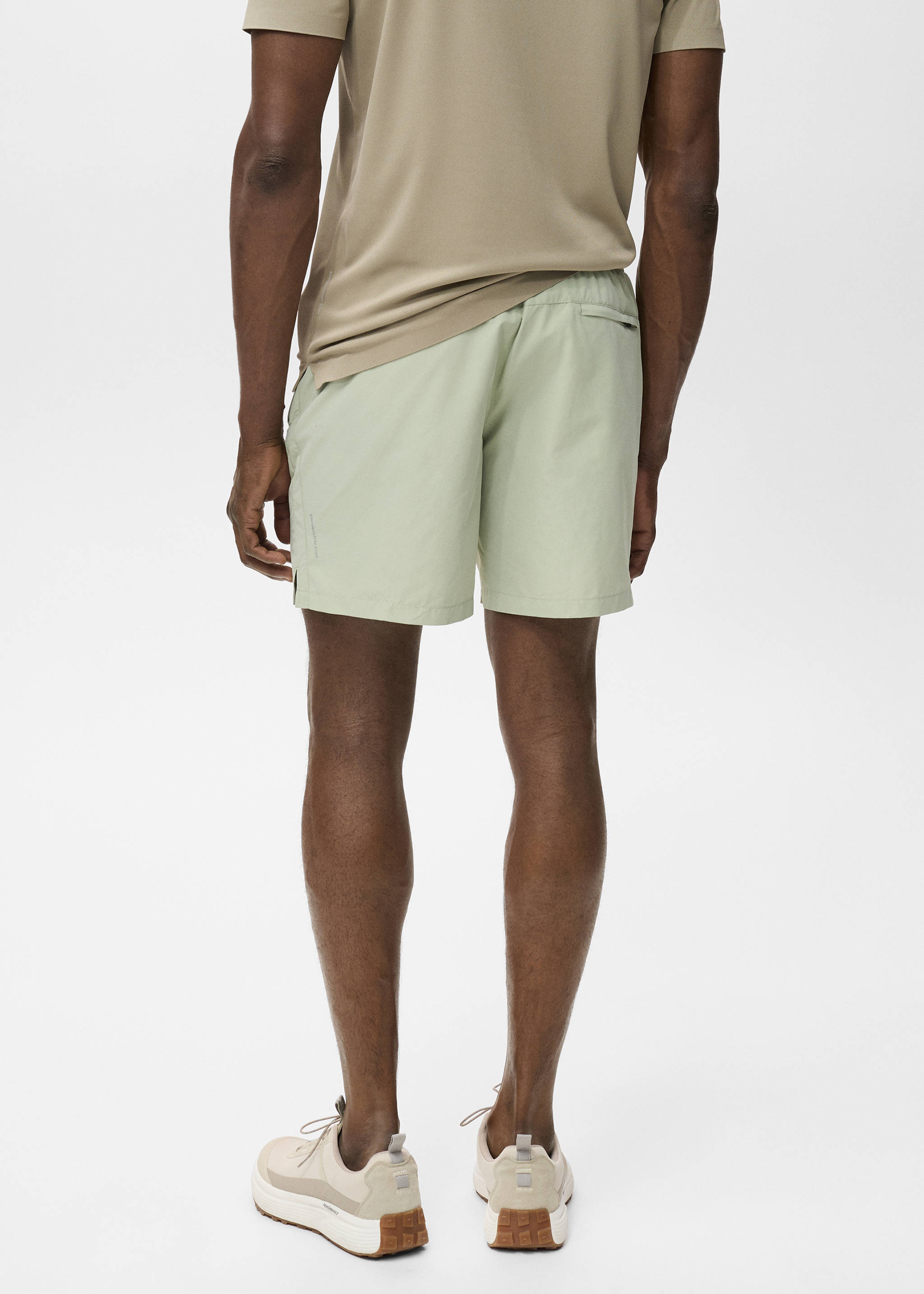 Badbyxa med fickor med dragkedja - Artikelns baksida