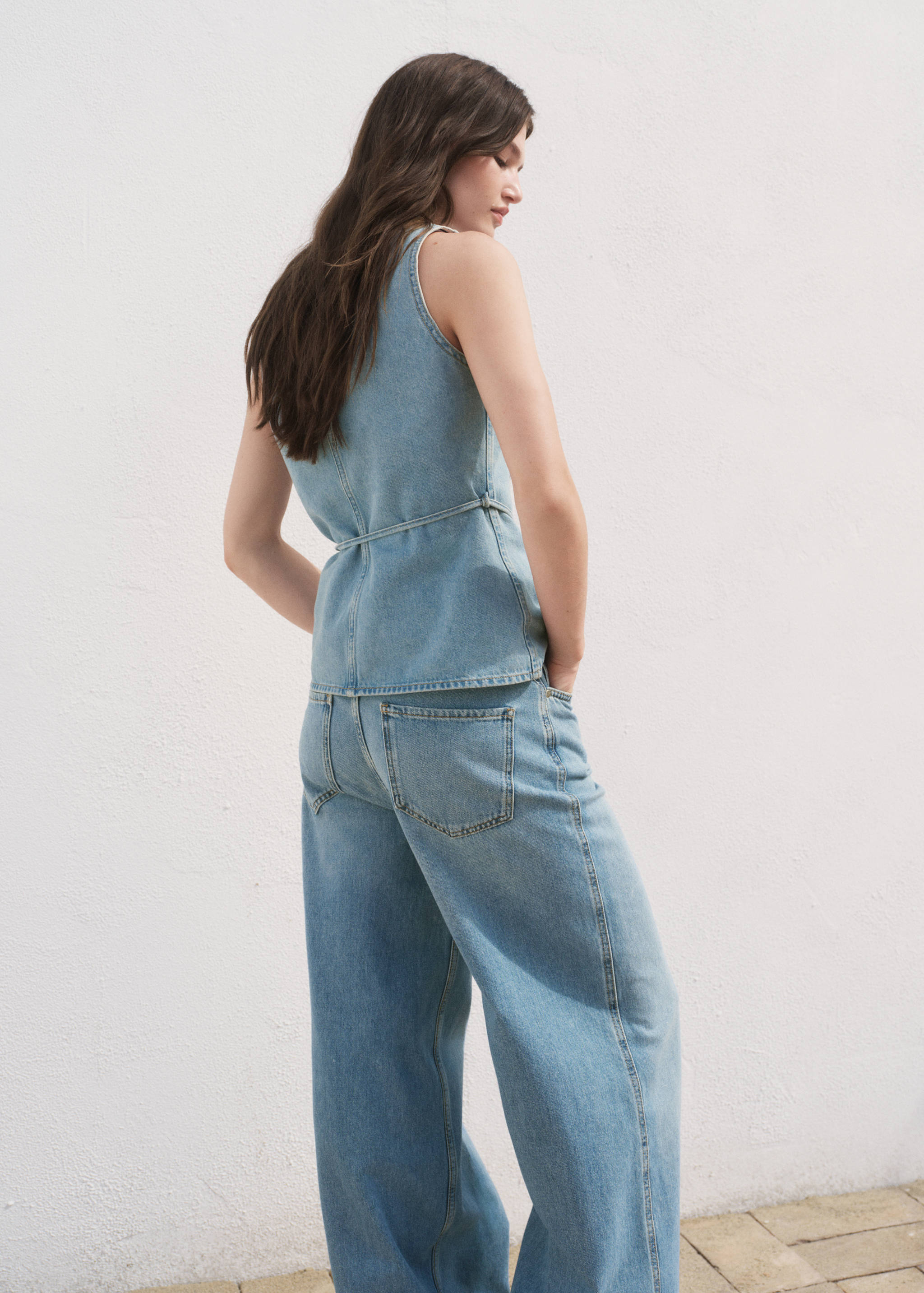 Buttoned denim vest - Reverse of the article