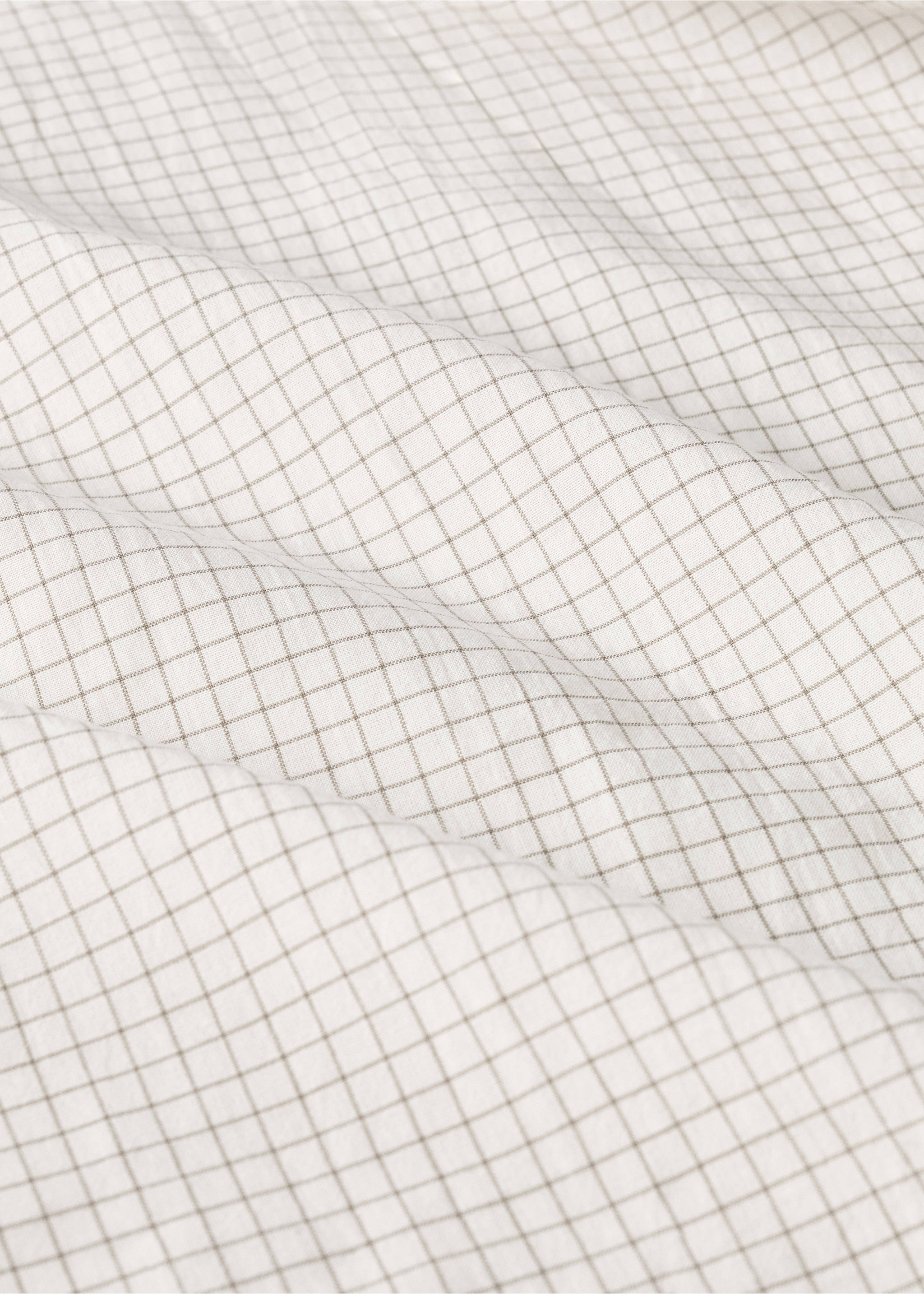 Cotton yarn-dyed fitted sheet with mini-check pattern for cot - Details of the article 2, Ecru. Ref: 17071566-00.