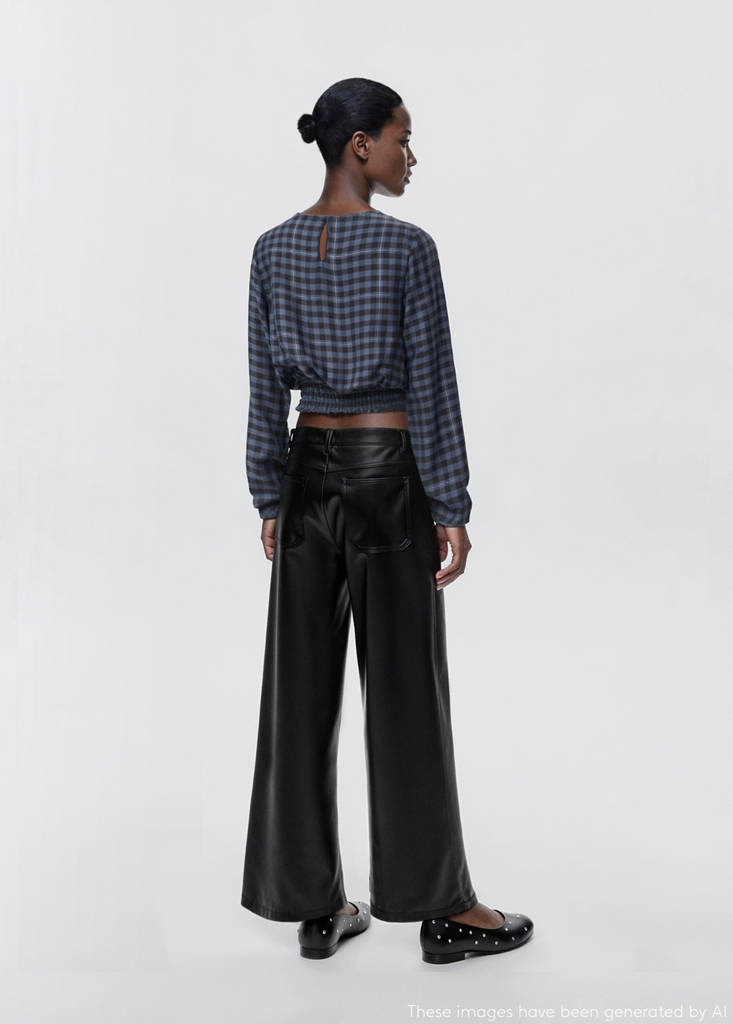 Studded leather-effect trousers — Black