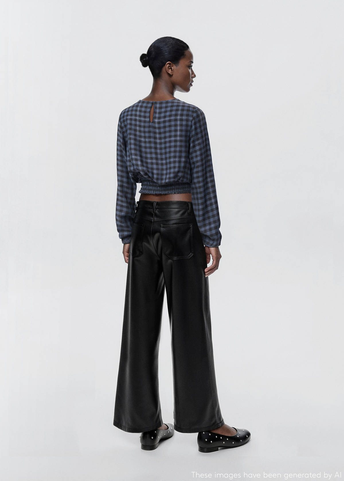 Studded leather-effect trousers — Black