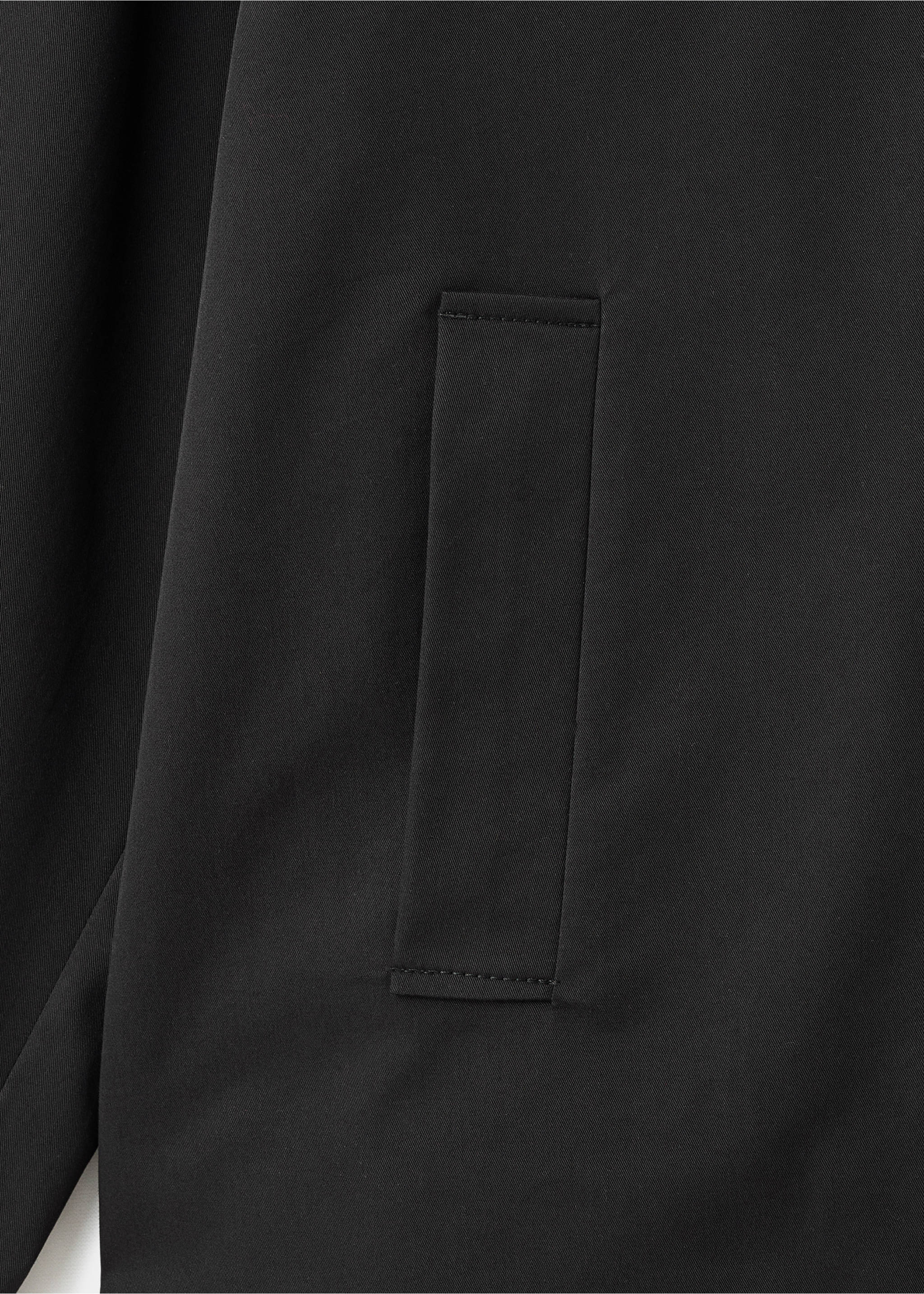 Short oversized trench coat with epaulettes - Details of the article 0, Black. Ref: 17075152-00.